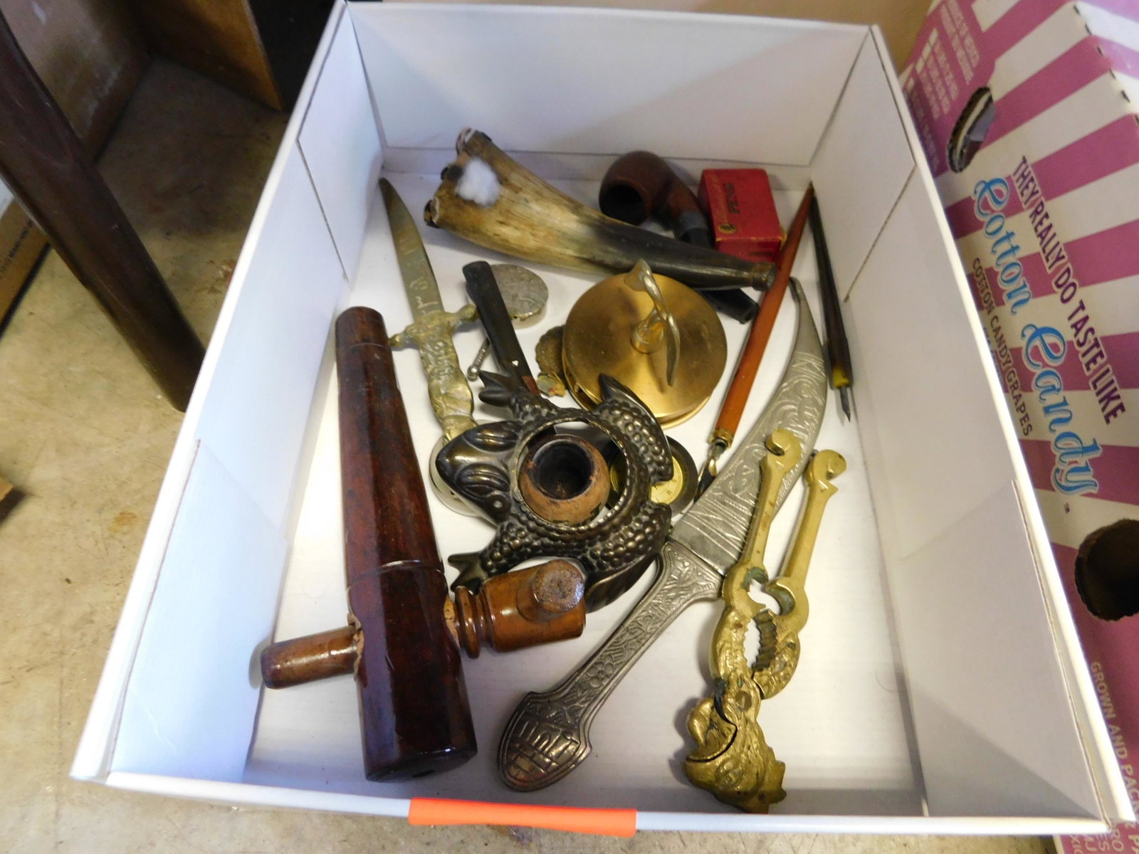 Box Lot with Powder Horn and Letter Opener: Box Lot with Powder Horn and Letter Opener. You are bidding at a live sale. Please read the terms and conditions. This sale will be broadcast live on sale day with full descriptions of each lot being 