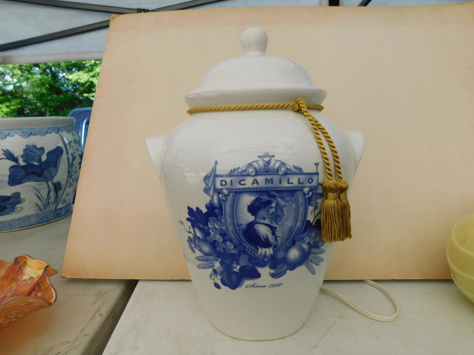 DiCamillo's Bakery Biscuit Jar: DiCamillo's Biscuit Jar. Measures 12" t. You are bidding at a live sale. Please read the terms and conditions. This sale will be broadcast live on sale day with full descriptions of each lot being sol