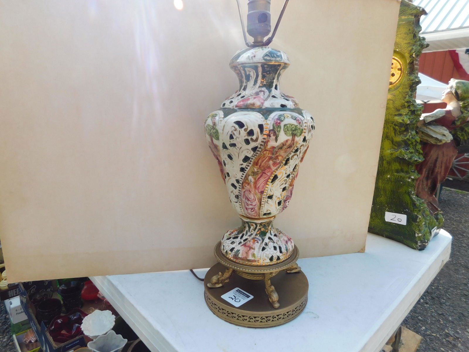 Capodimonte Table Lamp: Capodimonte Table Lamp. Measures 28" t. You are bidding at a live sale. Please read the terms and conditions. This sale will be broadcast live on sale day with full descriptions of each lot being sold