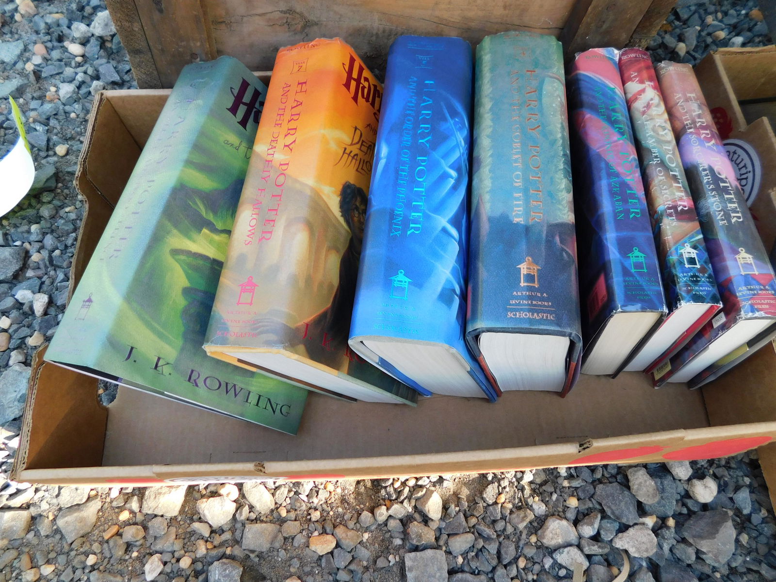 Box Lot of Harry Potter Books: Box Lot of Harry Potter Books. You are bidding at a live sale. Please read the terms and conditions. This sale will be broadcast live on sale day with full descriptions of each lot being sold, as well