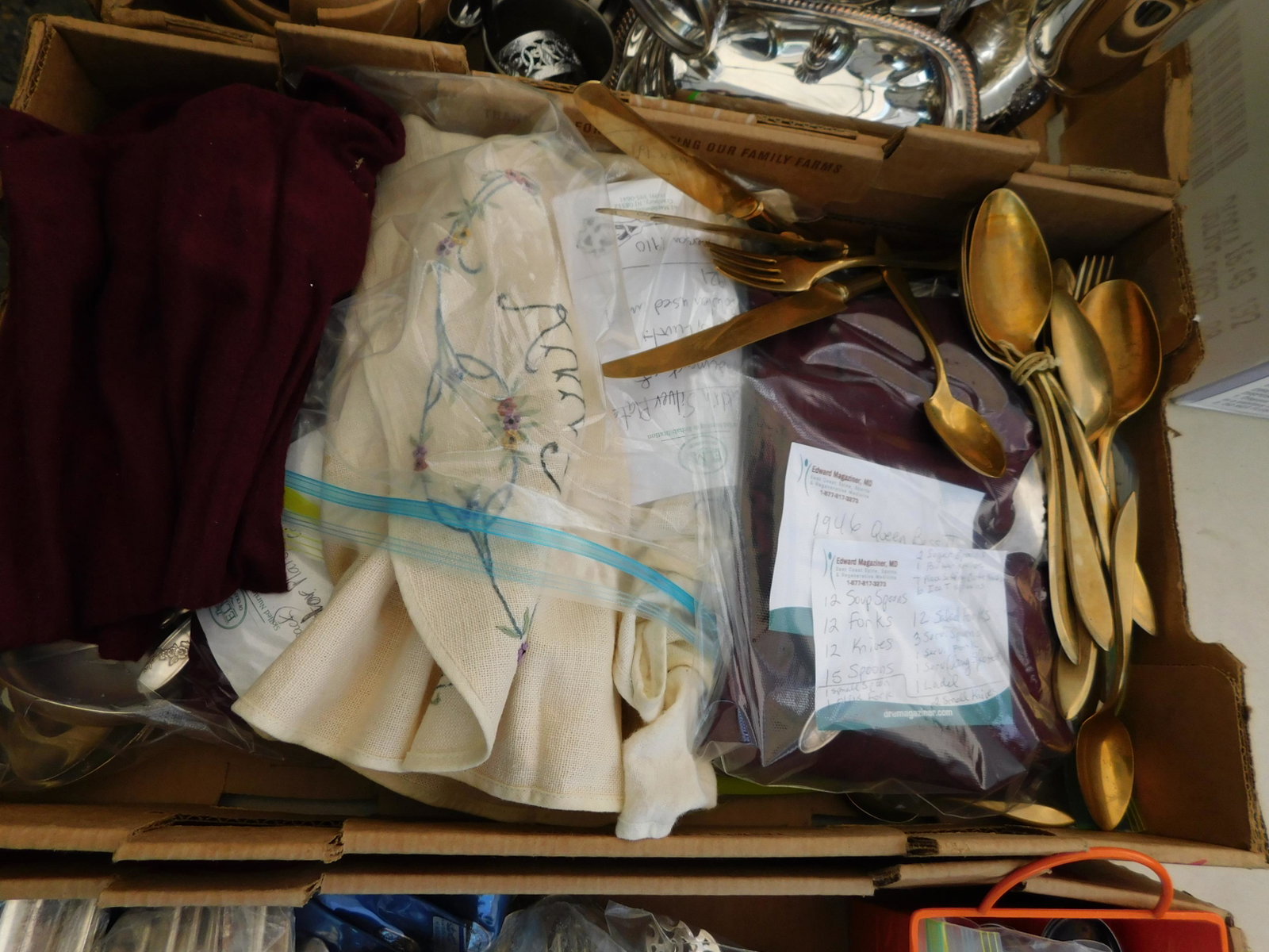 Box Lot of Silver-plate and Gold Flatware: Box Lot of Silver-plate and Gold Flatware. You are bidding at a live sale. Please read the terms and conditions. This sale will be broadcast live on sale day with full descriptions of each lot being s