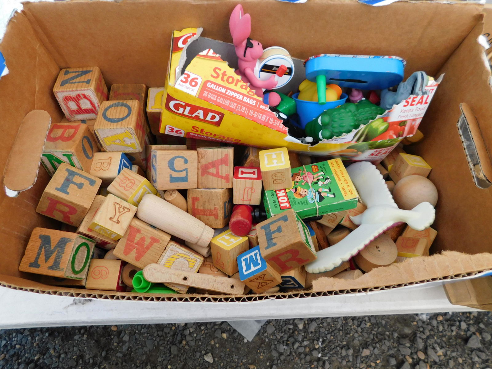 Box Lot of Wooden Blocks and Toys: Box Lot of Wooden Blocks and Toys. You are bidding at a live sale. Please read the terms and conditions. This sale will be broadcast live on sale day with full descriptions of each lot being sold, as