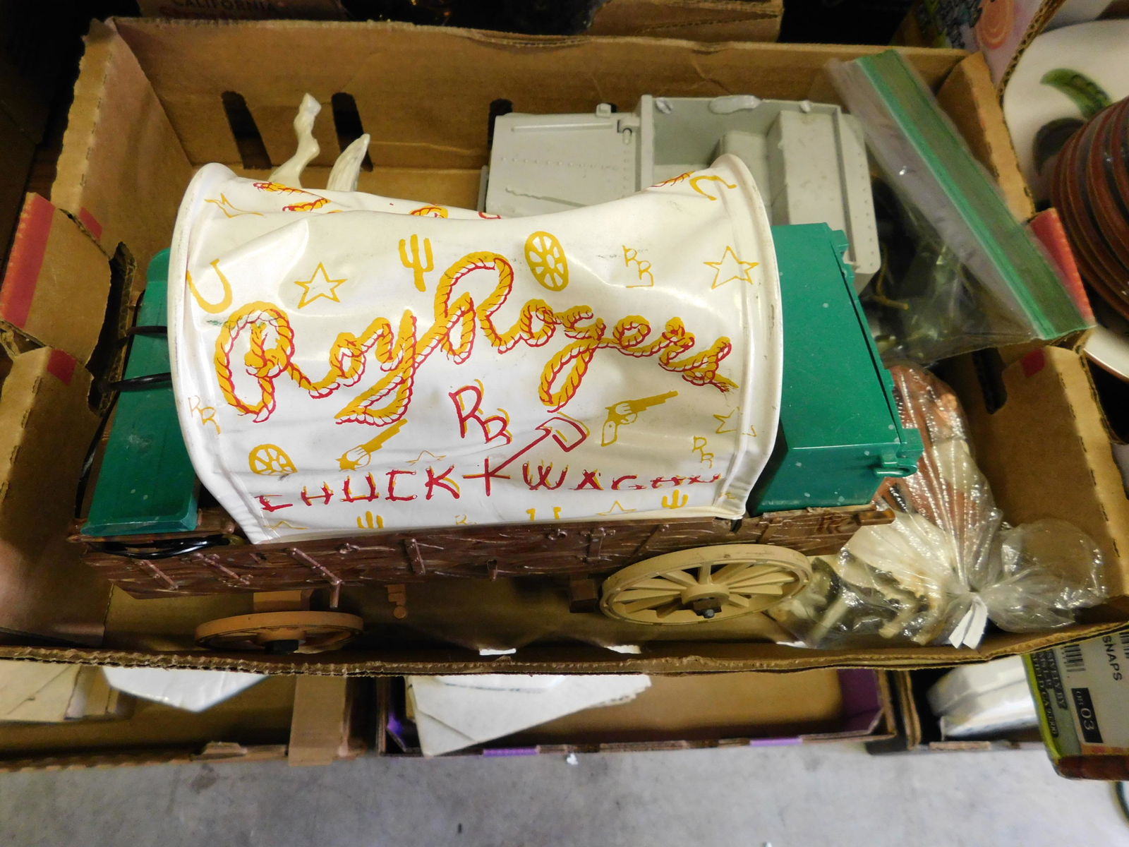 Box Lot of Toys and Roy Rogers: Box Lot of Toys with Roy Rogers Wagon. You are bidding at a live sale. Please read the terms and conditions. This sale will be broadcast live on sale day with full descriptions of each lot being sold,