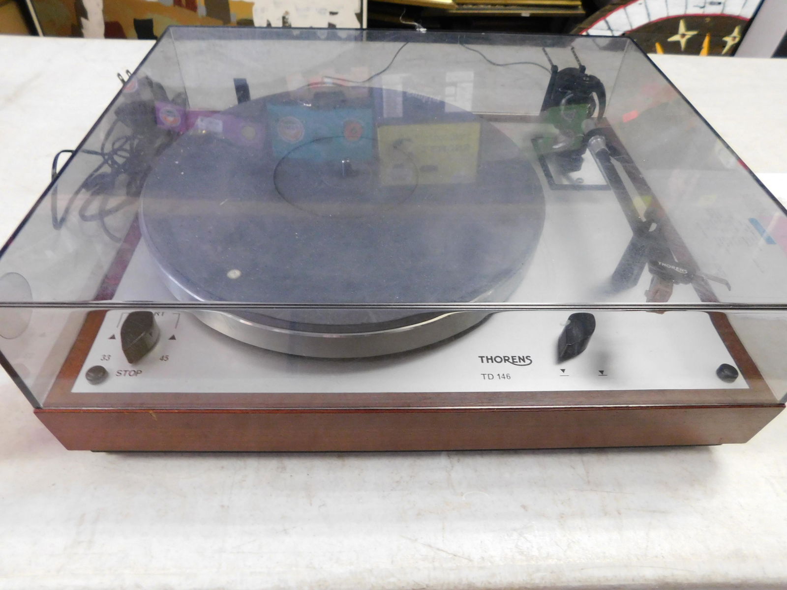 Thorens TD146 Turntable: Thorens TD146 Turntable. You are bidding at a live sale. Please read the terms and conditions. This sale will be broadcast live on sale day with full descriptions of each lot being sold, as well as vi