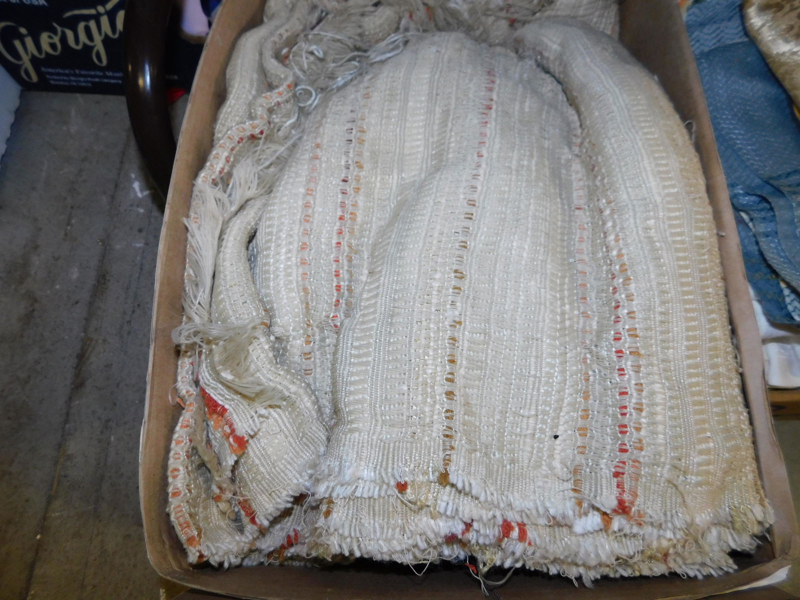 Box Lot of Textiles: Box Lot of Textiles. You are bidding at a live sale. Please read the terms and conditions. This sale will be broadcast live on sale day with full descriptions of each lot being sold, as well as video