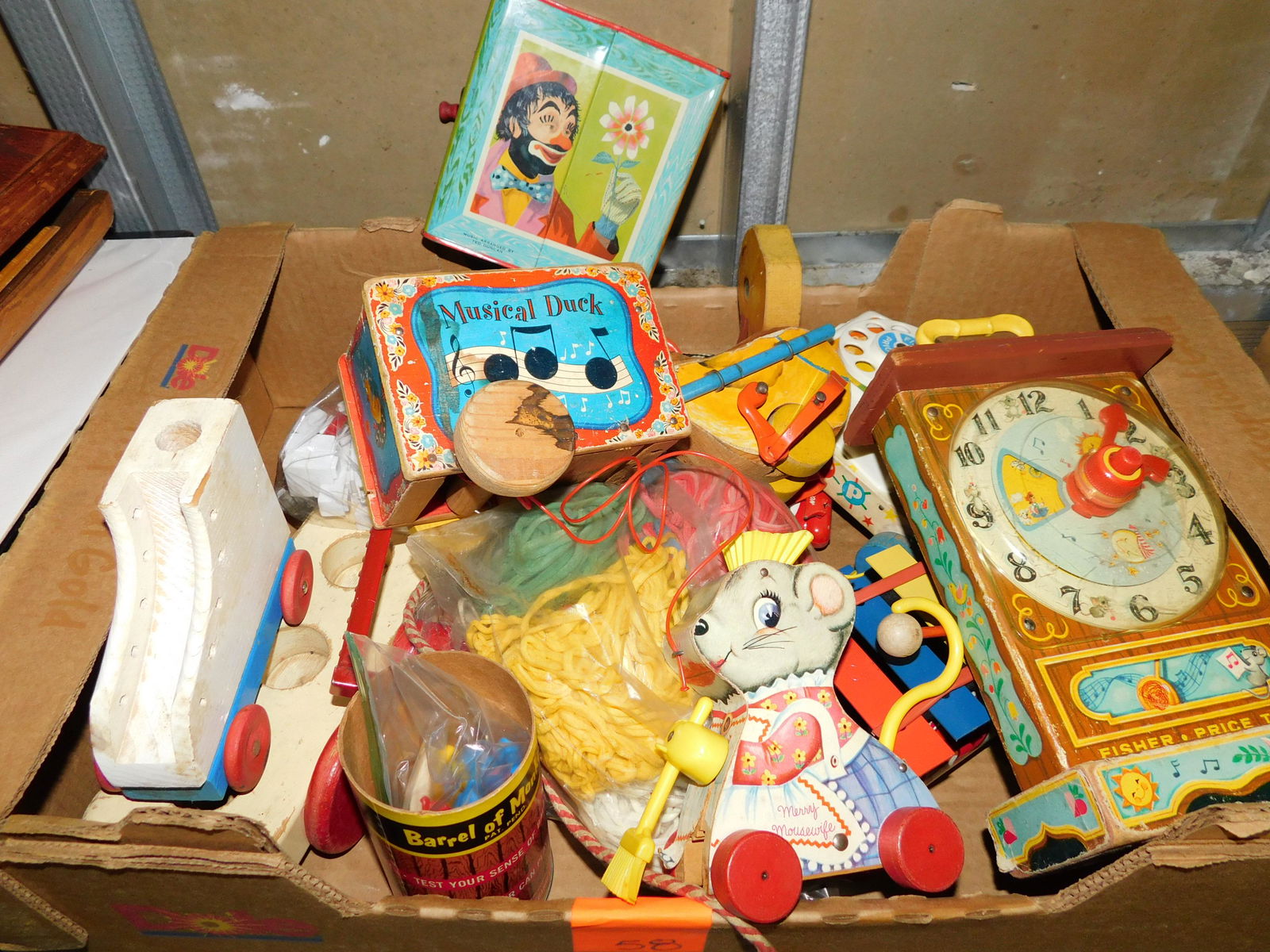 Box Lot of Vintage Fisher Price and Toys: Box Lot of Vintage Fisher Price and Other Toys. You are bidding at a live sale. Please read the terms and conditions. This sale will be broadcast live on sale day with full descriptions of each lot be