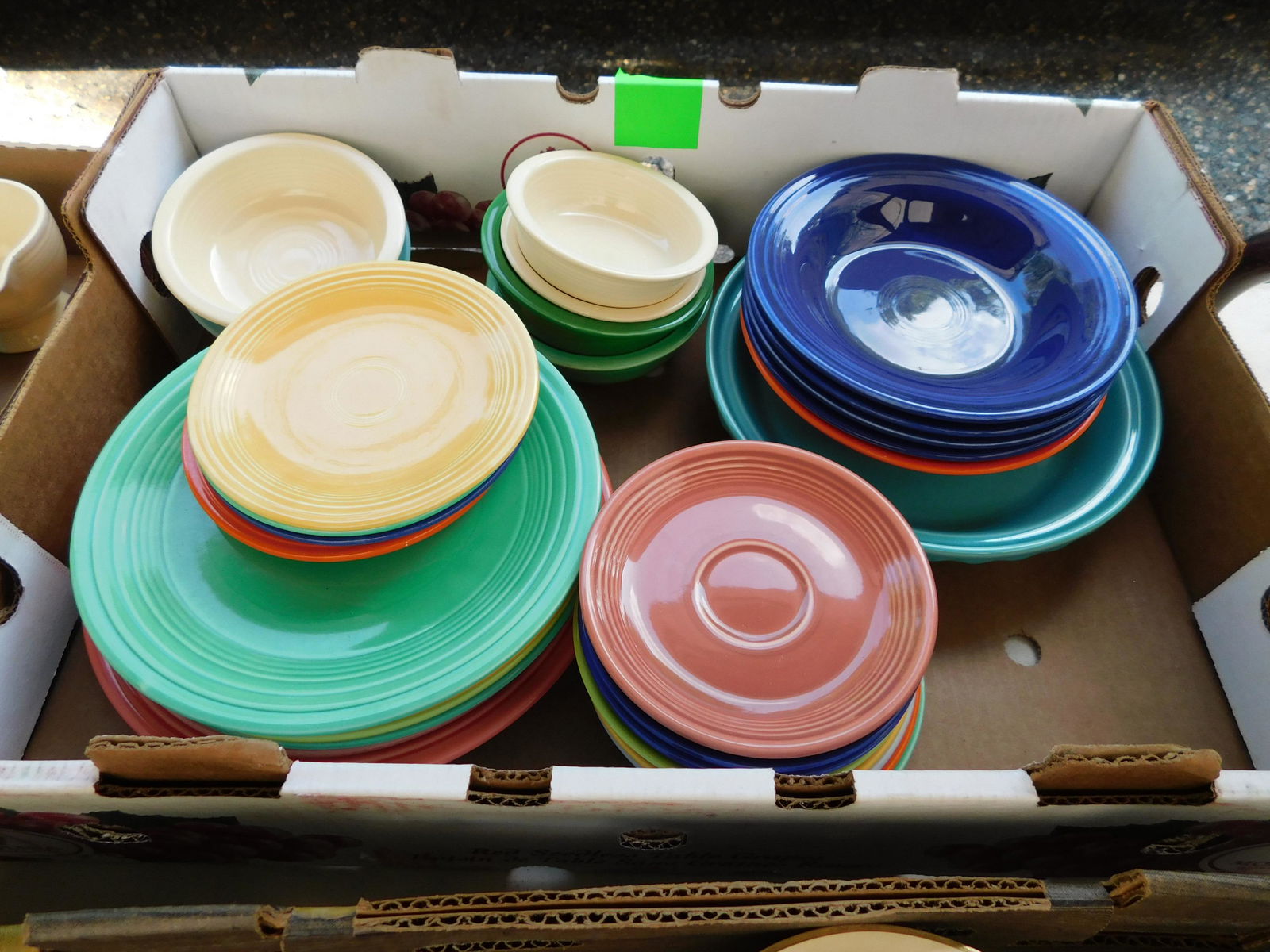 Box Lot of Fiestaware: Box Lot of Fiestaware. You are bidding at a live sale. Please read the terms and conditions. This sale will be broadcast live on sale day with full descriptions of each lot being sold, as well as vide