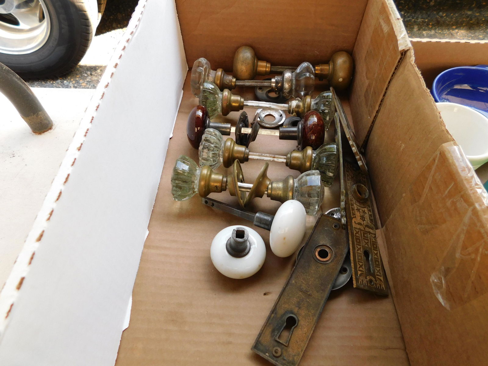 Box Lot of Antique Doorknobs: Box Lot of Antique Doorknobs. You are bidding at a live sale. Please read the terms and conditions. This sale will be broadcast live on sale day with full descriptions of each lot being sold, as well