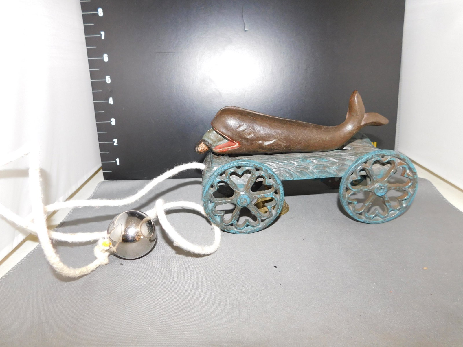 Cast Iron Jonah the Whale Pull Bell Toy: Cast Iron Jonah and the Whale Pull Bell Toy. Vintage to Antique. Measures approx. 4.5" t x 8" w. You are bidding at a live sale, please read the terms and conditions. We are offering contact-less pick