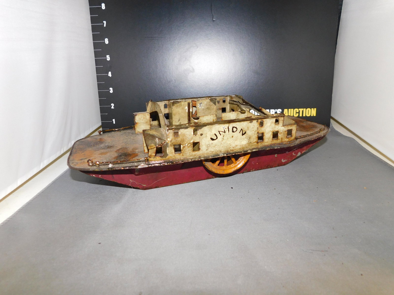 Early Tin Riverboat: Early Key Wind Tin Riverboat. As Found. Measures approx. 3" t x 12" w. You are bidding at a live sale, please read the terms and conditions. We are offering contact-less pick ups at our South Brunswic