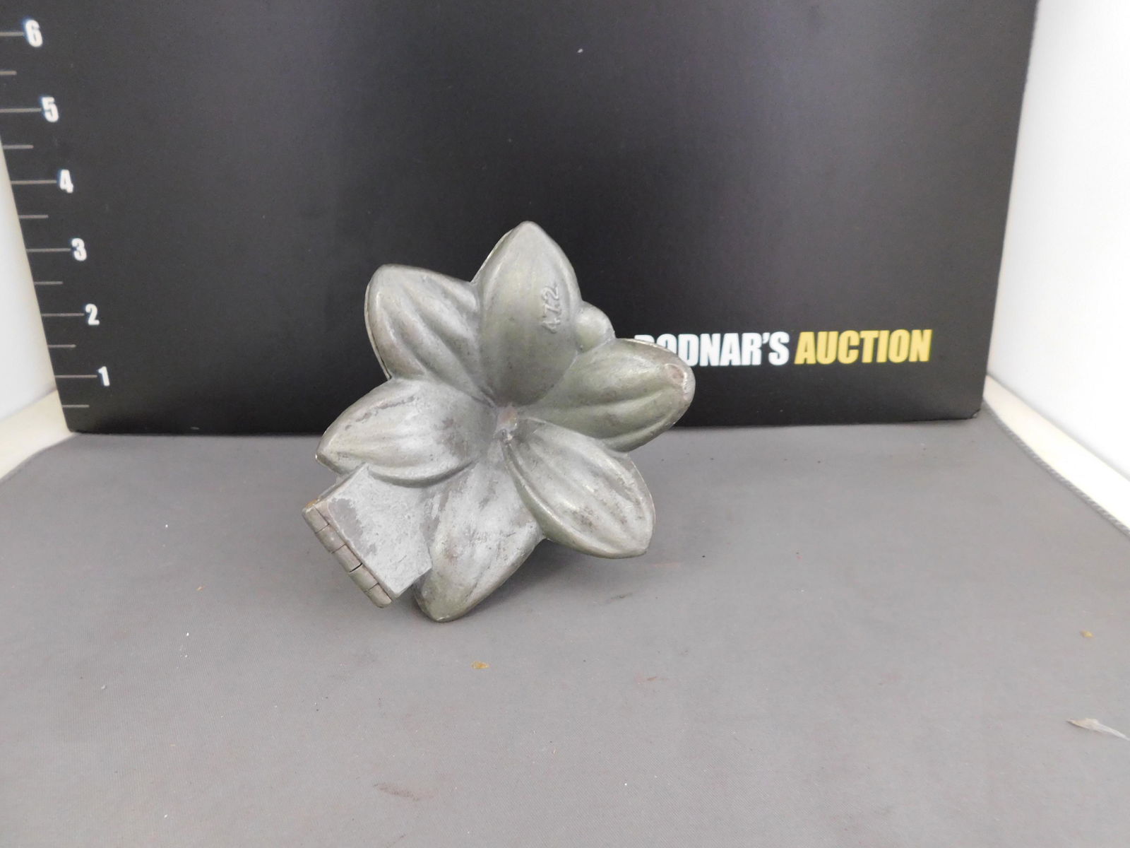 Antique Mold of a Lily: Antique Mold Possibly for Ice Cream In the Form of a Lily. #472. Measures approx 4.5" t x 5" w. You are bidding at a live sale, please read the terms and conditions. We are offering contact-less pick