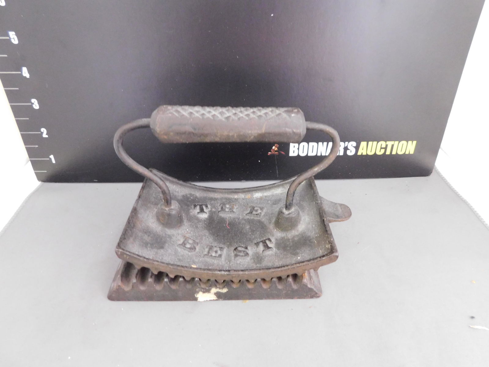 Cast Iron Curling Iron: Cast Iron Curling Iron - The Best #297. Measures approx. 4.5" t x 5.5" w. You are bidding at a live sale, please read the terms and conditions. We are offering contact-less pick ups at our South Bruns