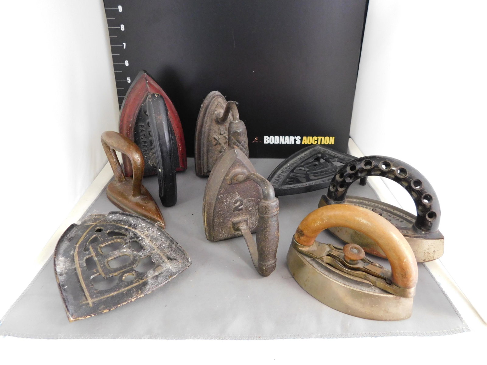 Lot of 6 Sad Irons: Lot of 6 Sad Irons including Ober #7, BXX4, Enterprise #72, and others. The largest measures 6.5" t x 5.5" w. You are bidding at a live sale, please read the terms and conditions. We are offering cont
