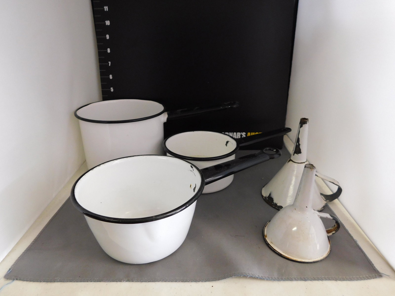 Lot of 5 Vintage Enamel Cooking Pots and Funnels: Lot of 5 Vintage Enamel Cooking Pots and Funnels. You are bidding at a live sale, please read the terms and conditions. We are offering contact-less pick ups at our South Brunswick location by APPOINT