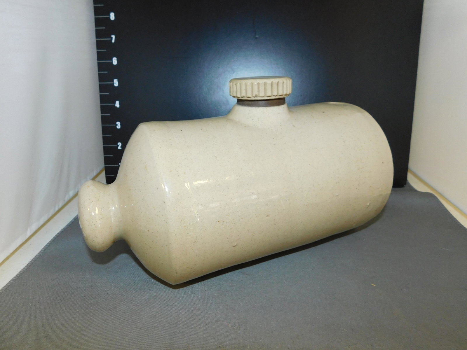 Stoneware Water Cooler/Heater: Stoneware Water Cooler/Heater. Signed Pearsons A Chesterfield. Measures approx. 9" t x 6" w. You are bidding at a live sale, please read the terms and conditions. We are offering contact-less pick ups