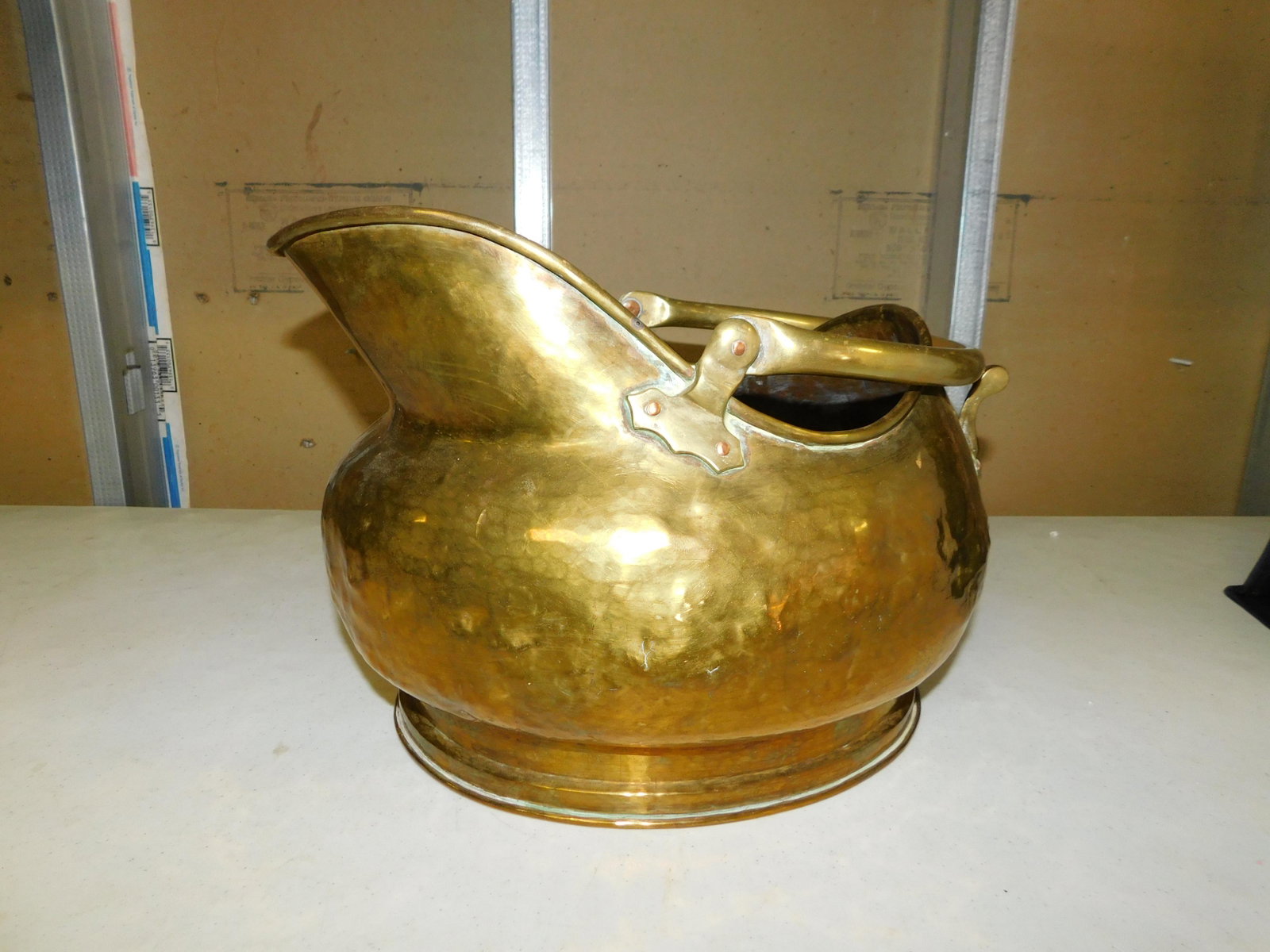 Copper and Brass Fireplace Bucket: Copper and Brass Fireplace Bucket. Measures approx. 10.5" t x 14" w. You are bidding at a live sale, please read the terms and conditions. We are offering contact-less pick ups at our South Brunswick 