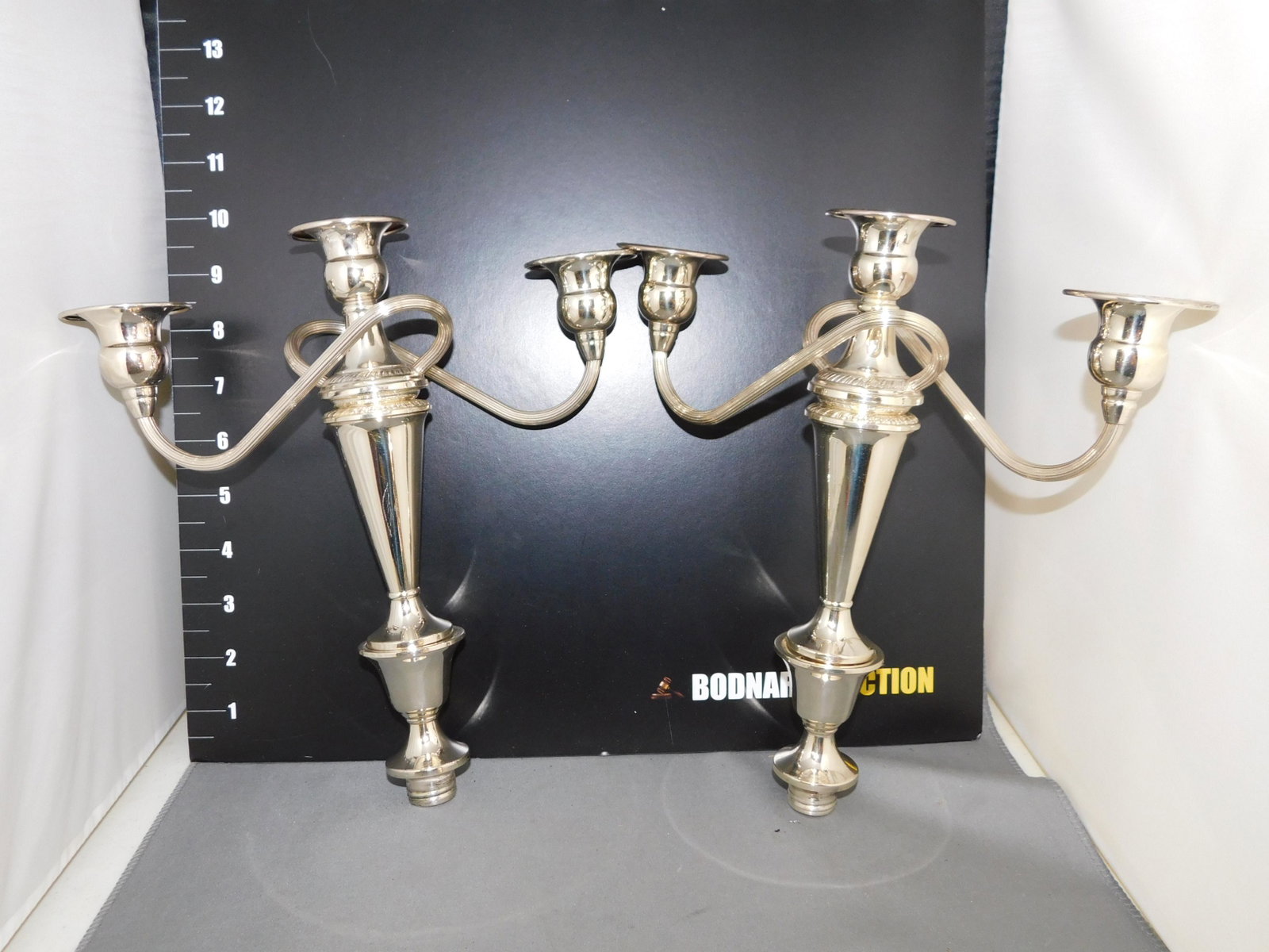 Pair of Sterling Silver Inserts for Candelabras: Pair of Sterling Silver Inserts. No Base. Measures 10" L. You are bidding at a live sale, please read the terms and conditions. We are offering contact-less pick ups at our South Brunswick location by
