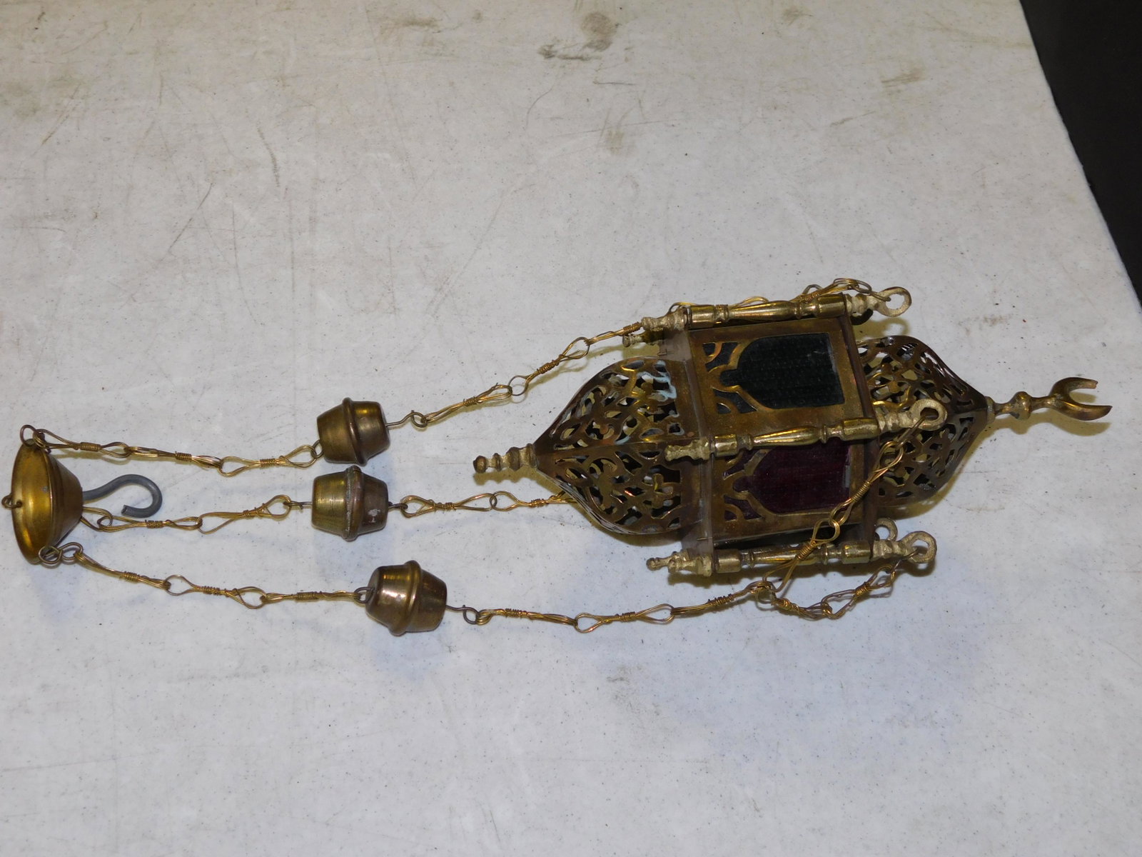 Middle Eastern Candelabra: Middle Eastern Hanging Candelabra. Measures approx. 11.5" long. You are bidding at a live sale, please read the terms and conditions. We are offering contact-less pick ups at our South Brunswick locat