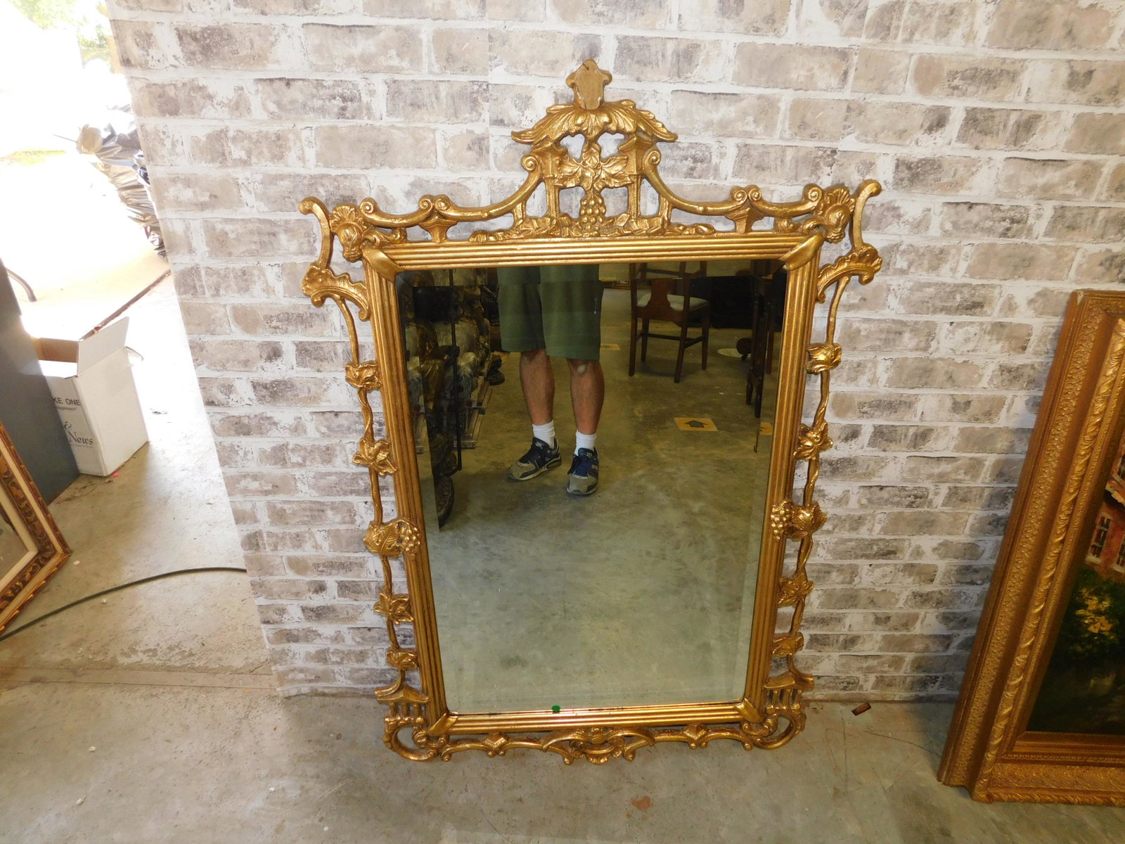 Chinese Gold Gilded Mirror: Chinese Gold Gilded Hand Carved Beveled Mirror. As - Is Center Decoration. 53" Tall x 35" you are bidding at a live sale. Please read the terms and conditions. This sale will be broadcast live on sale