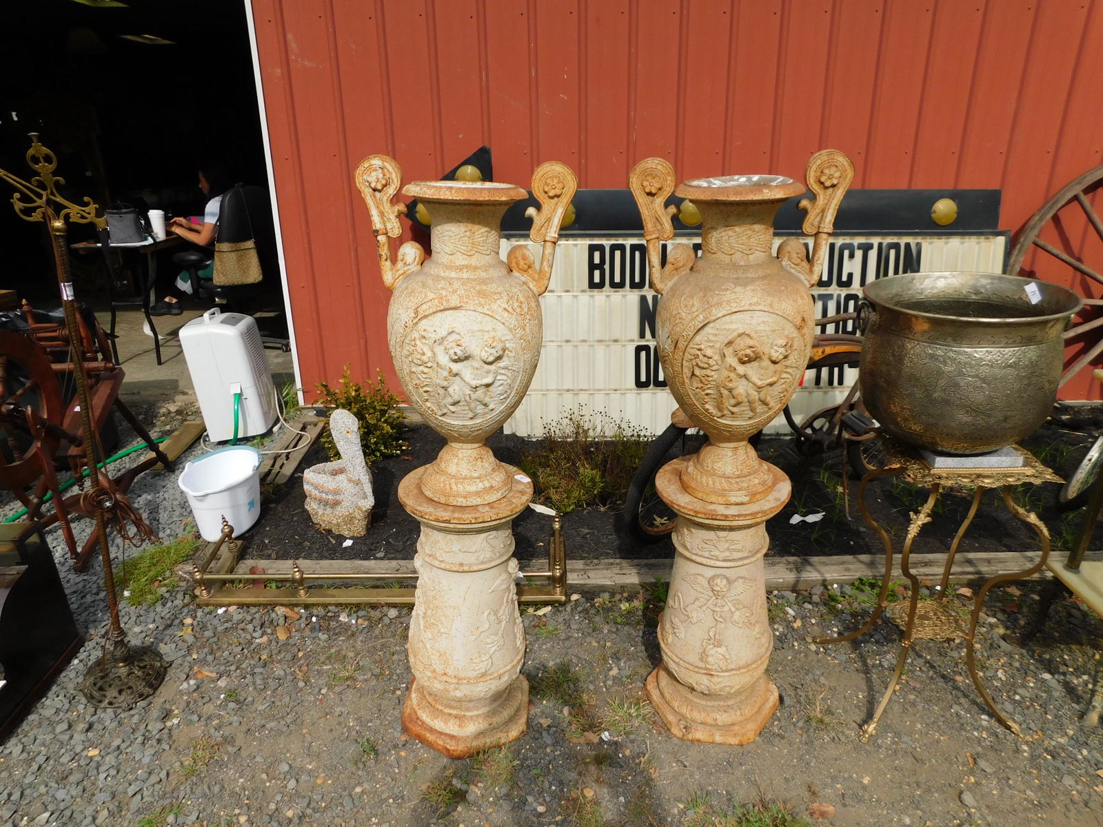Pair of Cast Iron Cherub Urns on Bases (1 of 6)