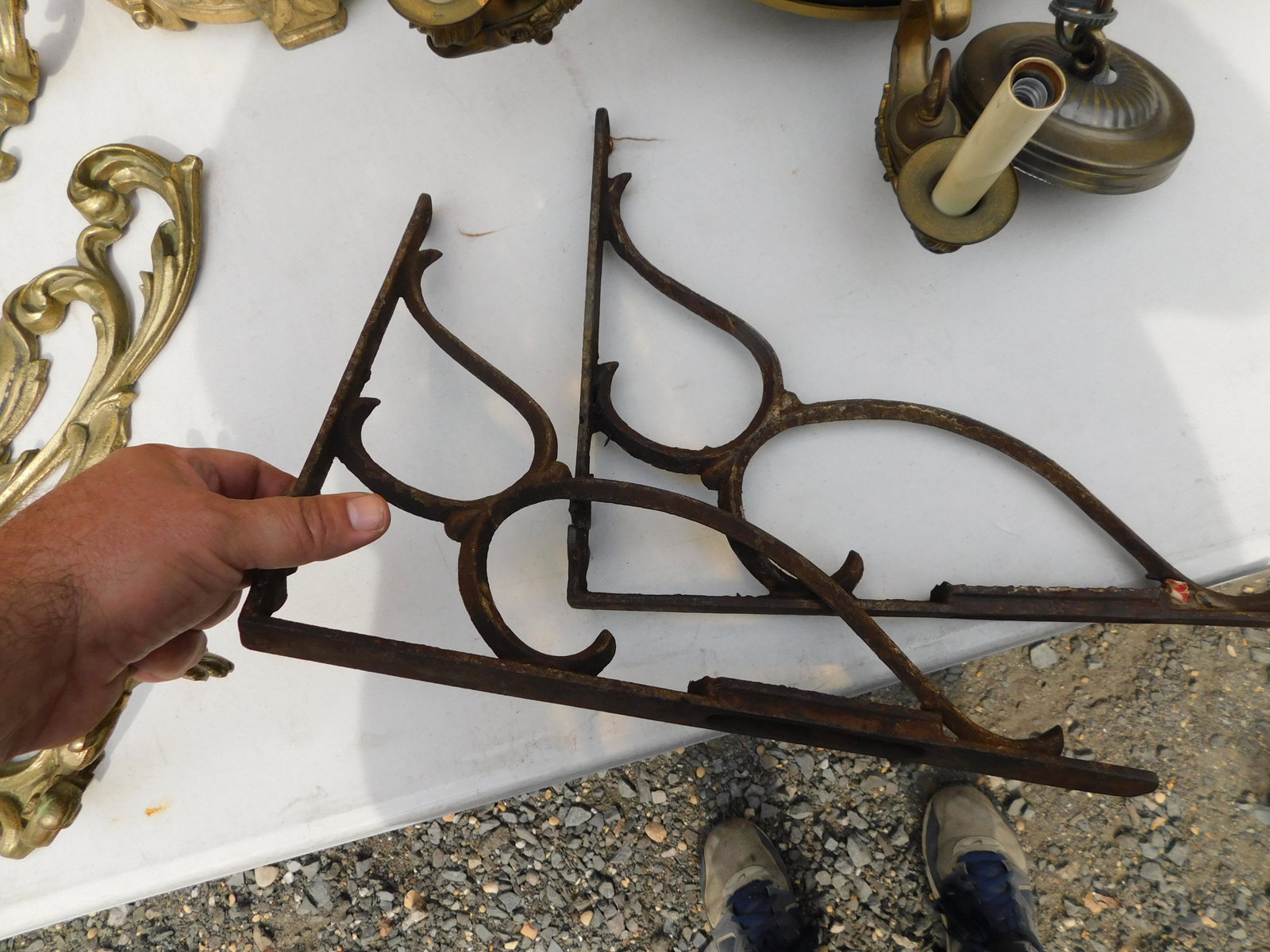 Pair of Iron Brackets: Pair of Iron Brackets. Measures 11" tall x 15"w. You are bidding at a live sale. Please read the terms and conditions. This sale will be broadcast live on sale day with full descriptions of each lot b