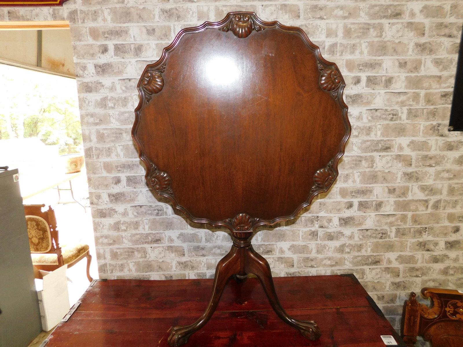 Mahogany Flip Top Pie Crust Table: Mahogany Flip Top Pie Crust Table. Measures 30" high x 25.5" d. You are bidding at a live sale. Please read the terms and conditions. This sale will be broadcast live on sale day with full description