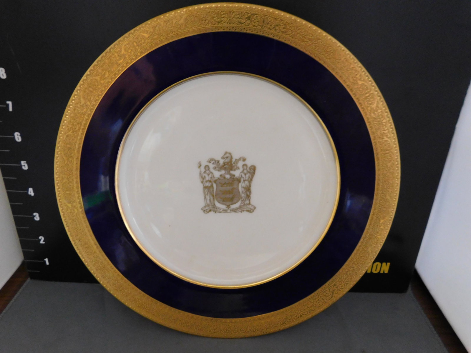 New Jersey State Shield Plate by Lenox: New Jersey State Shield Plate by Lenox. Measures 10.5" diameter. You are bidding at a live sale, please read the terms and conditions. We are offering contact-less pick ups at our South Brunswick loca