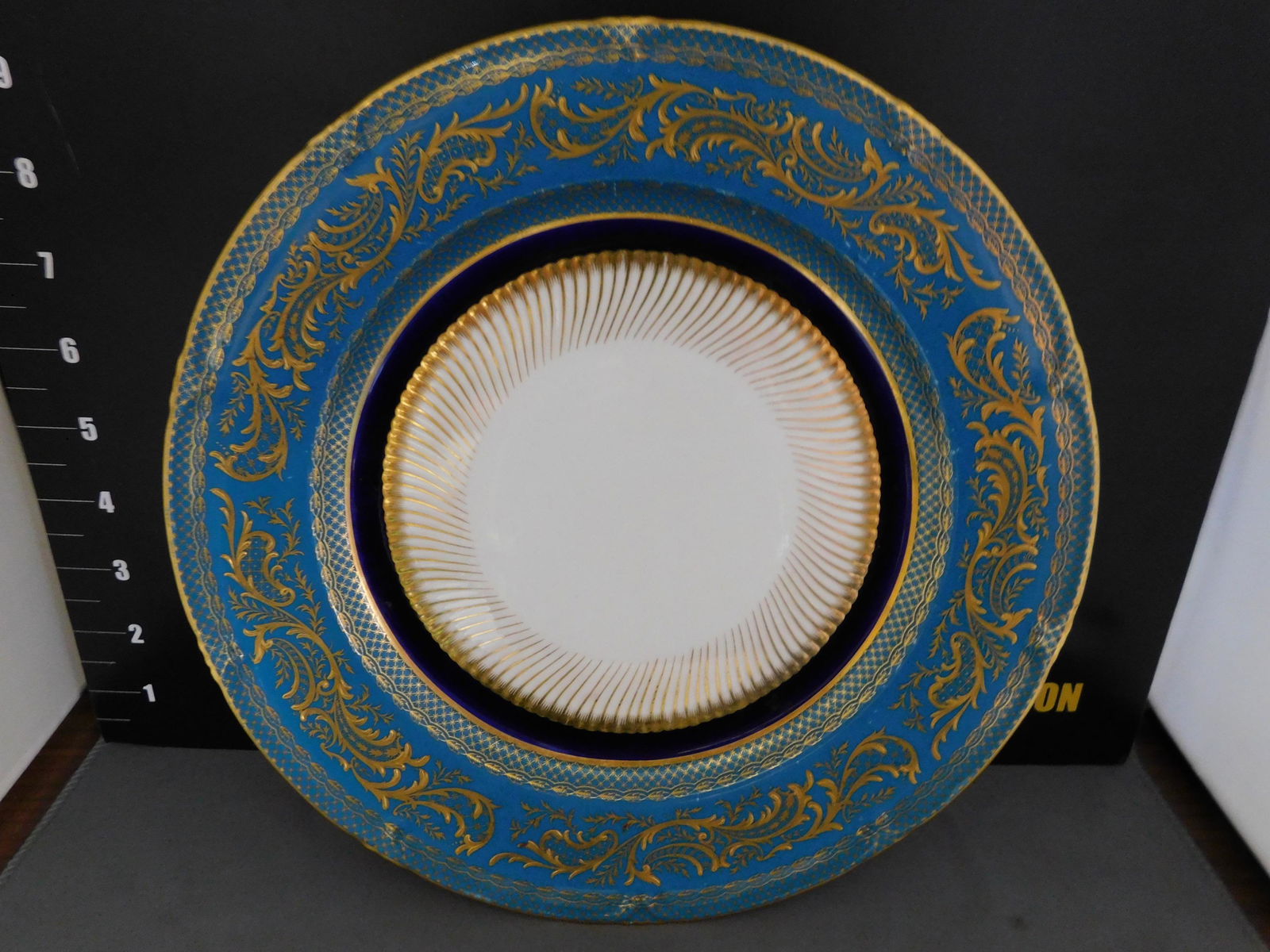 Couldon Charger: Couldon Charger with Gold Decoration. Measures approx. 10" diameter. You are bidding at a live sale, please read the terms and conditions. We are offering contact-less pick ups at our South Brunswick