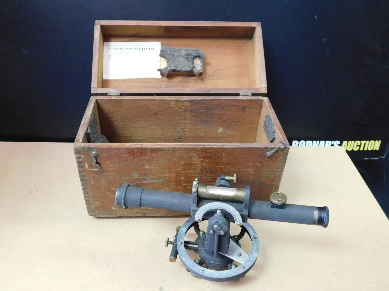 Sextant in Carrying Case: Sextant. Buff Industries Inc. New York. Comes in Wooden Carrying Case. Sextant measures 10" long. You are bidding at a live sale, please read the terms and conditions. We are offering contact-less pic