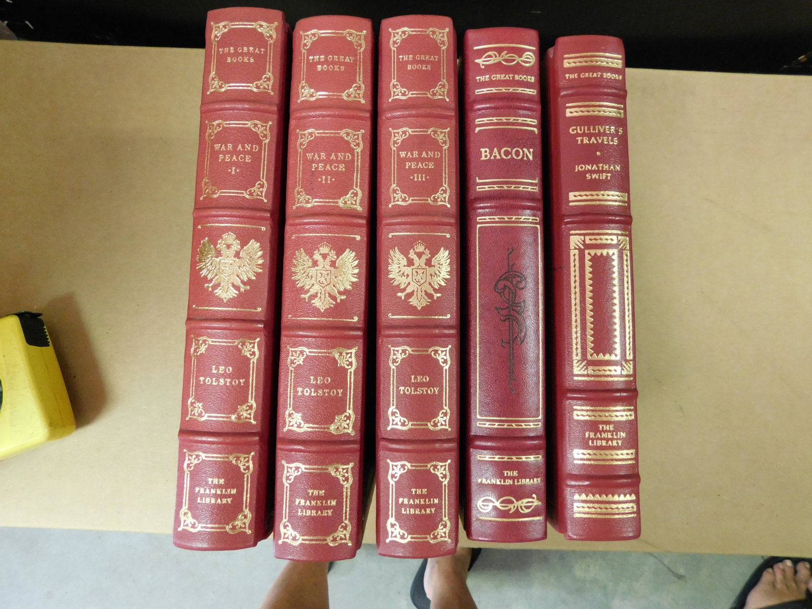 Lot of 5 Franklin Library Books: Lot of 5 Frankin Library Books. Included in this lot are 3 Volumes of War and Peace by Leo Tolstoy, Gulliver's Travels by Jonathan Swift and The Great Books by Sir Francis Bacon with drawings by Leona