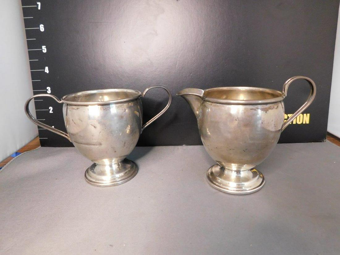 Sterling Silver Creamer and Sugar: Sterling Silver Creamer and Sugar Monogramed with Letter M. Has dents. You are bidding at a live sale, please read the terms and conditions. We are offering contact-less pick ups at our South Brunswic