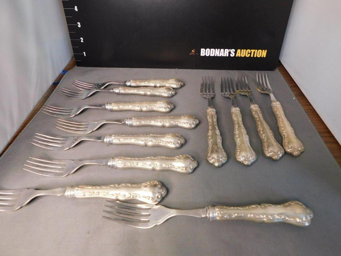 Set of 12 Sterling Silver Handled Salad Forks: Set of 12 Sterling Silver Handled Salad Forks with the monogram H. You are bidding at a live sale, please read the terms and conditions. We are offering contact-less pick ups at our South Brunswick lo