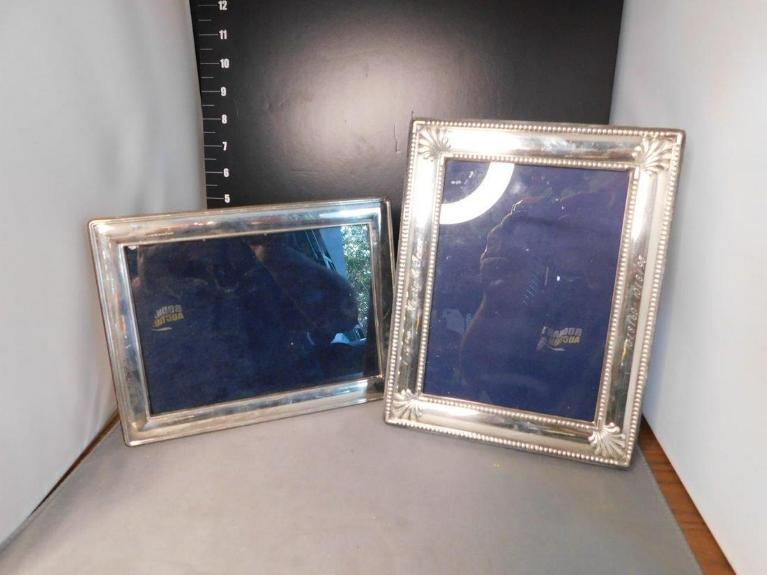 Pair of Sterling Silver Frames: Pair of Sterling Silver Frames. One frame has engraving of person's name. You are bidding at a live sale, please read the terms and conditions. We are offering contact-less pick ups at our South Bruns
