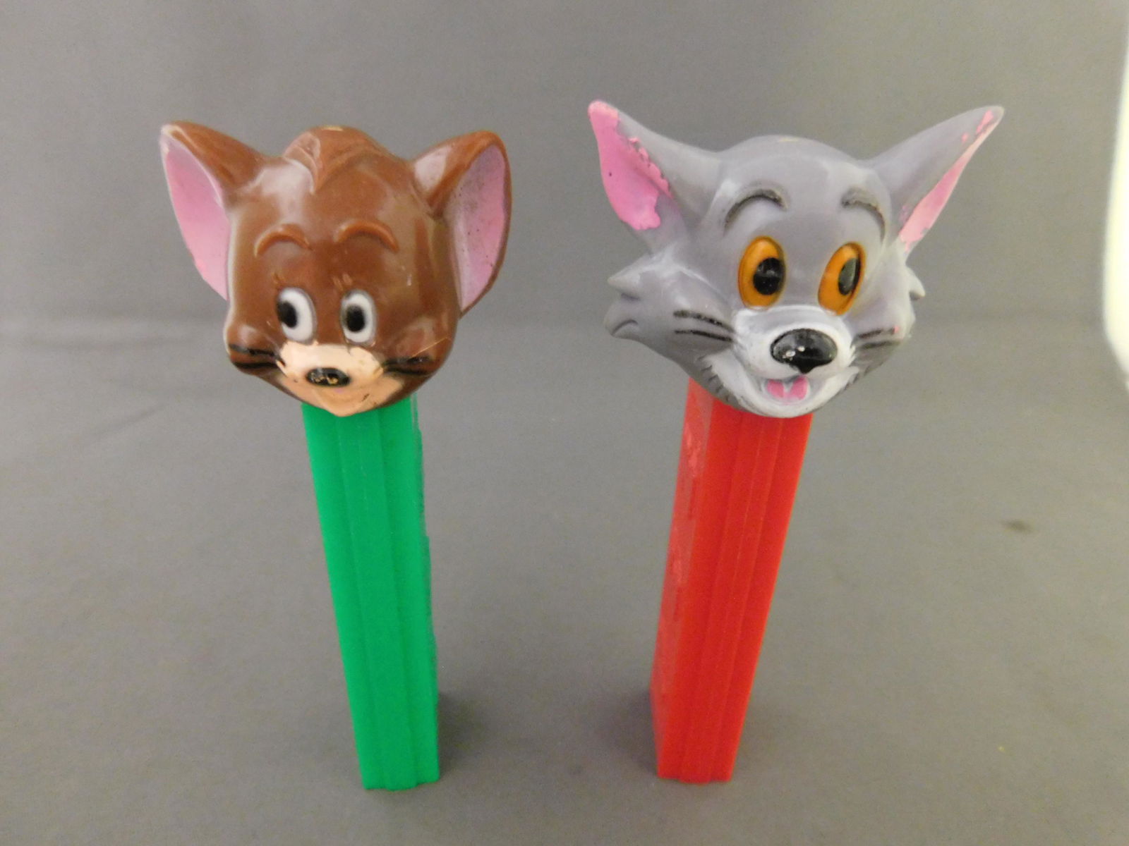Tom and Jerry Vintage Pez Lot of 2: Tom and Jerry Vintage Pez Lot of 2. They both have no feet. Both are made in Hong Kong. You are bidding at a live sale, please read the terms and conditions. We are offering contact-less pick ups at o