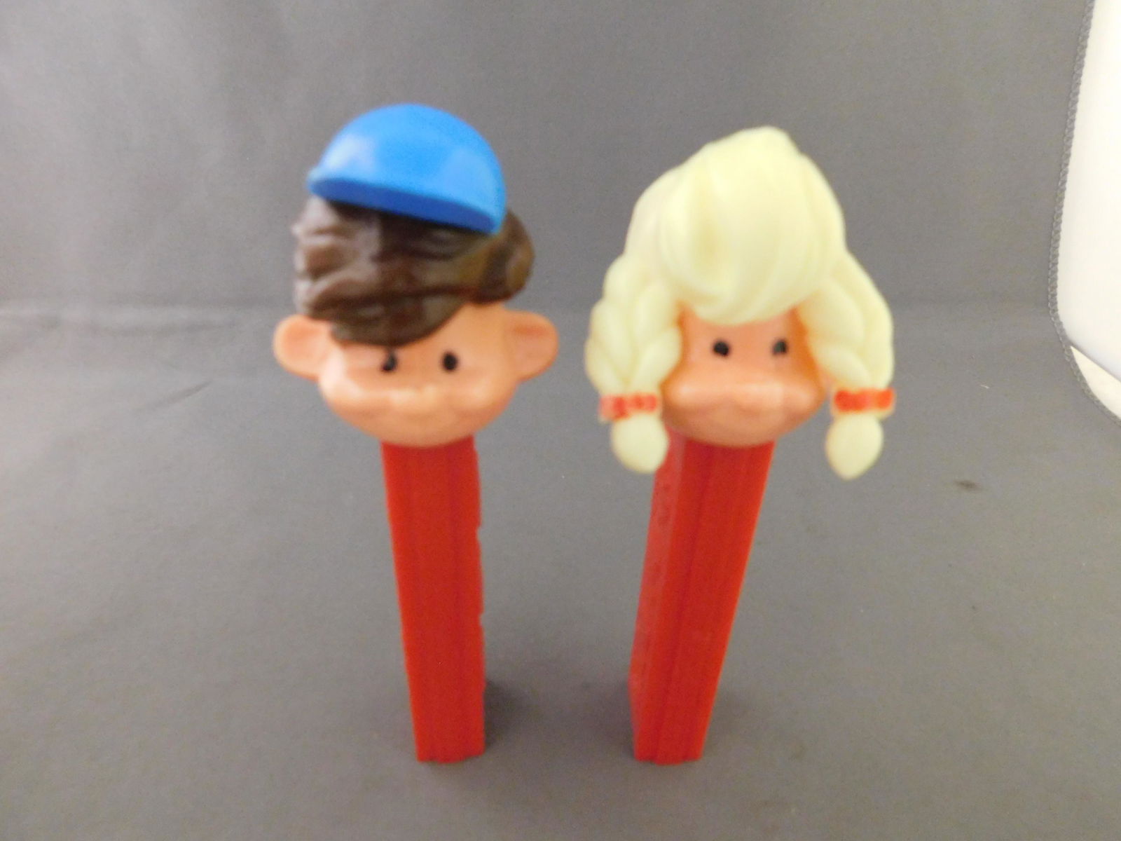 Girl and Boy Pez Pal Lot: Vintage Boy and Girl Pez Pal Lot of 2. They both have no feet. Both are made in Austria. You are bidding at a live sale, please read the terms and conditions. We are offering contact-less pick ups at