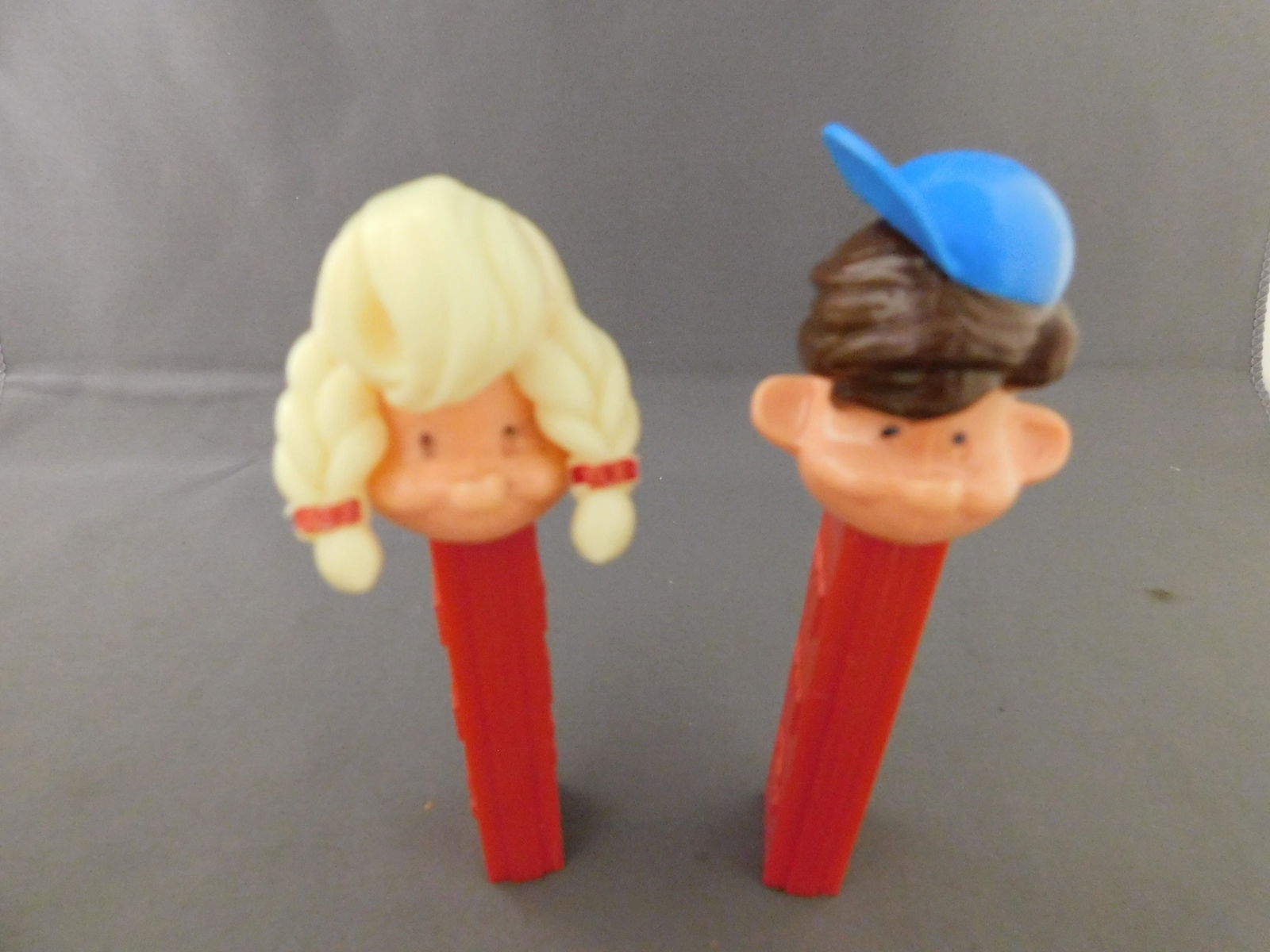 Girl and Boy Pez Pal Lot: Vintage Boy and Girl Pez Pal Lot of 2. They both have no feet. Both are made in Austria. You are bidding at a live sale, please read the terms and conditions. We are offering contact-less pick ups at