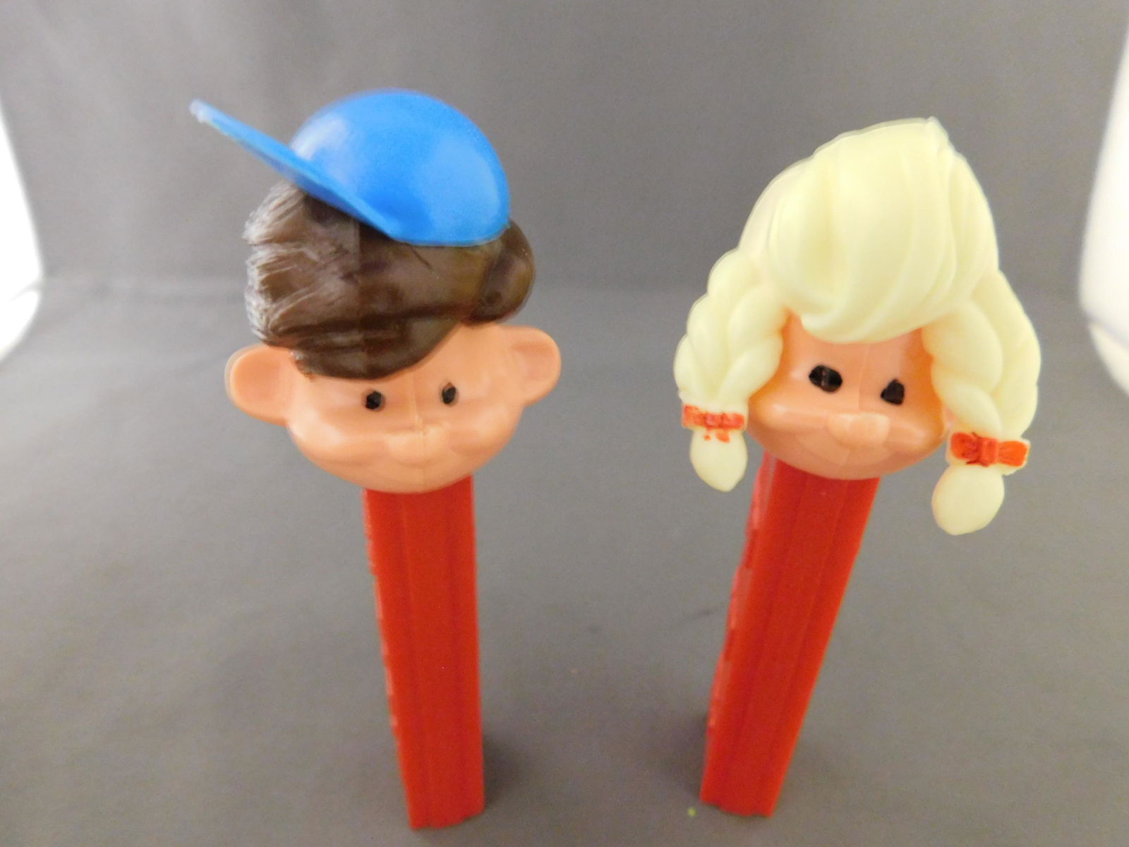 Girl and Boy Pez Pal Lot: Vintage Boy and Girl Pez Pal Lot of 2. They both have no feet. Both are made in Austria. You are bidding at a live sale, please read the terms and conditions. We are offering contact-less pick ups at