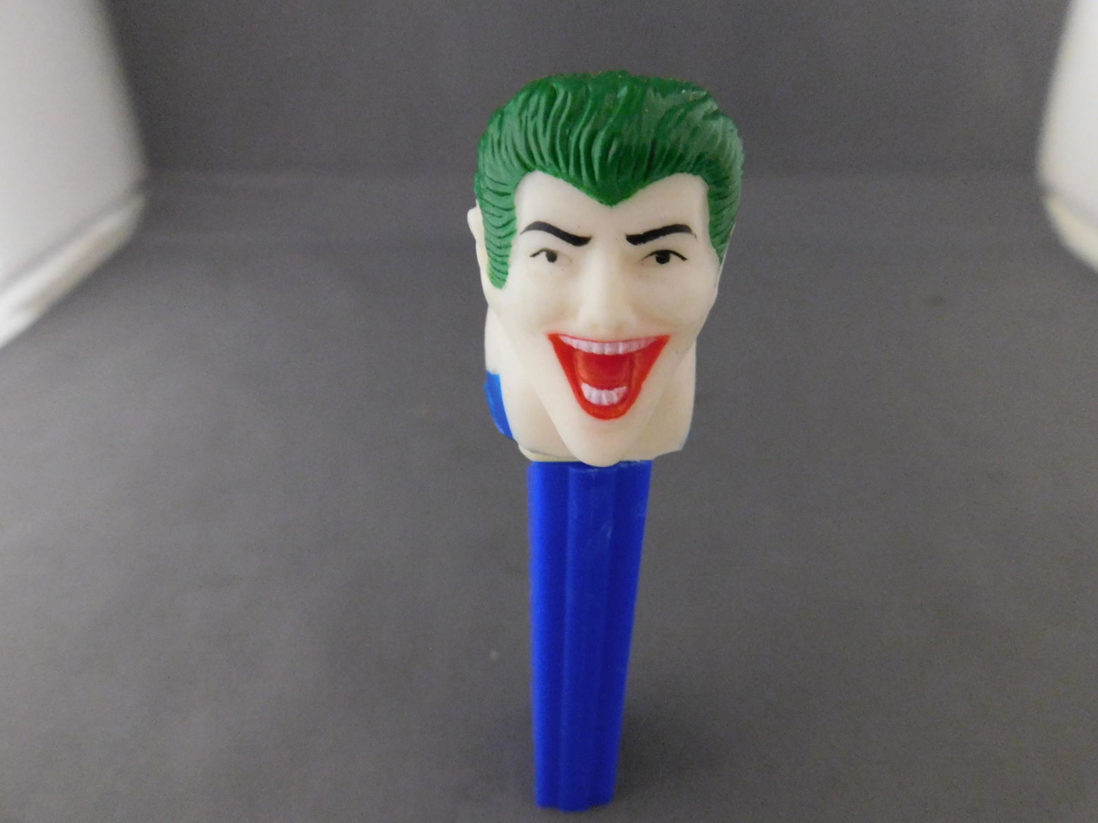 Vintage Soft Head Joker Pez: Vintage Soft Head Joker Pez. He has no feet. Head stamped Comics Inc. Body made in USA. You are bidding at a live sale, please read the terms and conditions. We are offering contact-less pick ups at o