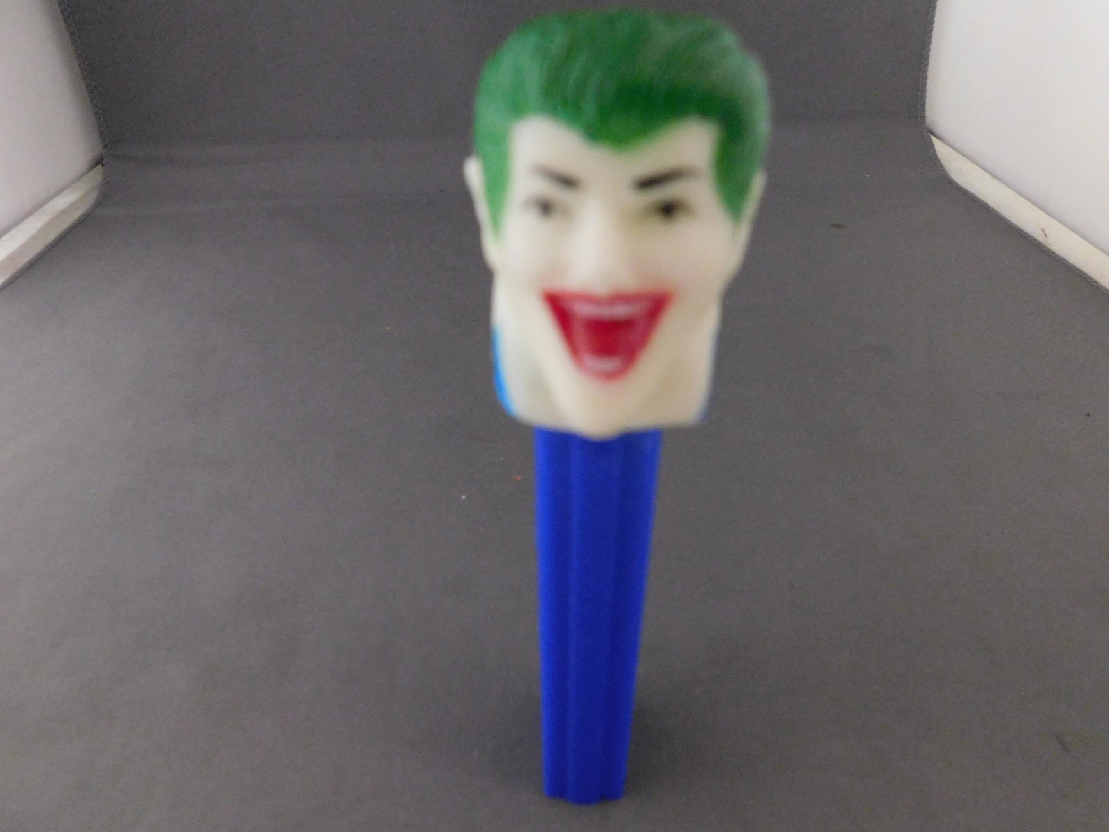 Vintage Soft Head Joker Pez: Vintage Soft Head Joker Pez. He has no feet. Head stamped Comics Inc. Body made in USA. You are bidding at a live sale, please read the terms and conditions. We are offering contact-less pick ups at o