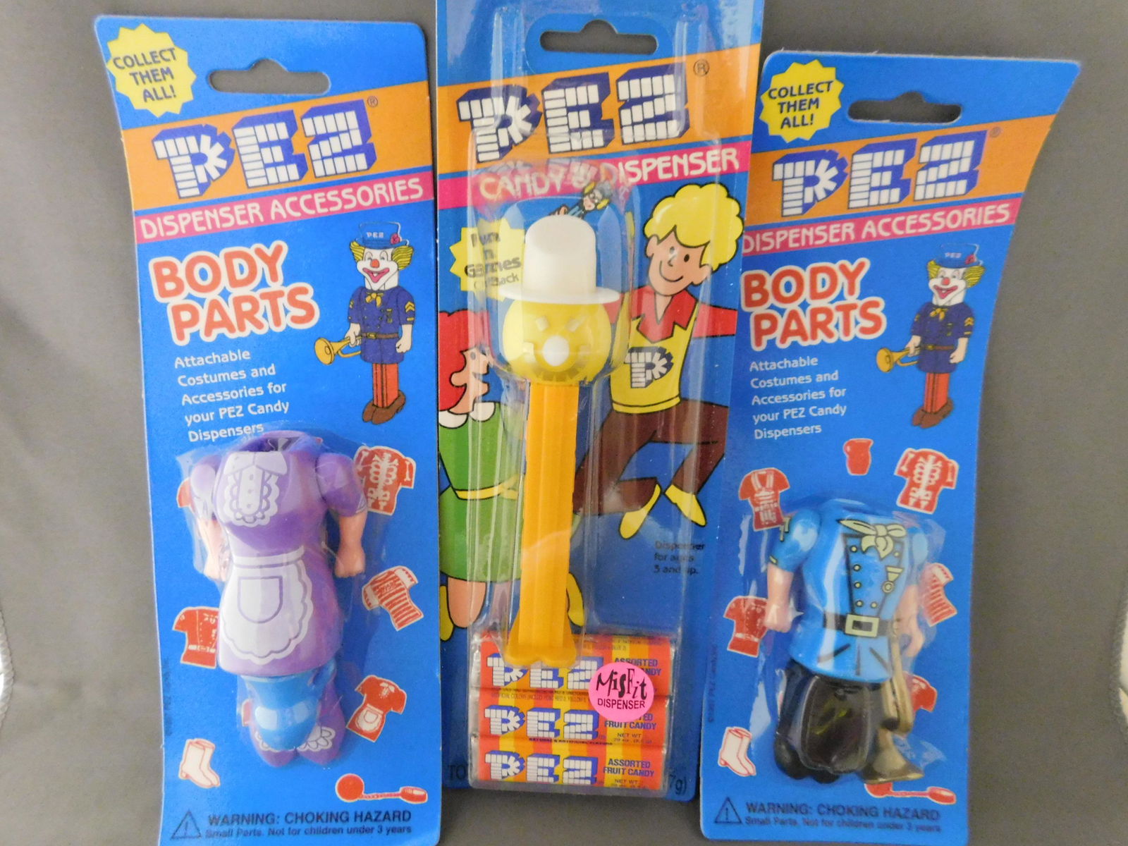 Lot of 3 Pez in Package including Snowman Misfit: Lot of 3 Pez in Package including 2 Body Parts Pez and Yellow Snowman Misfit Dispenser Pez. Has Feet. You are bidding at a live sale, please read the terms and conditions. We are offering contact-less