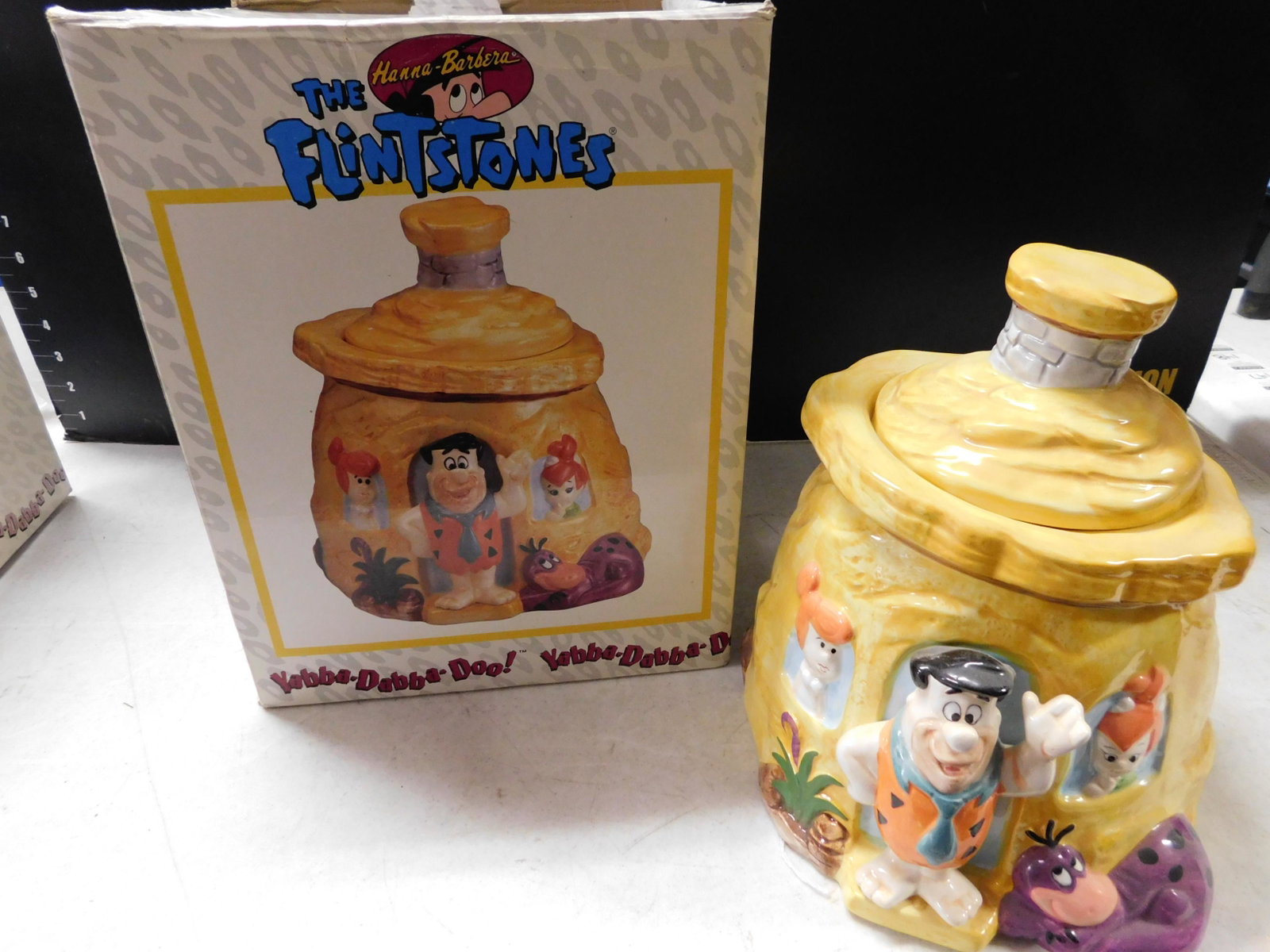 The Flintstones Cookie Jar: The Flintstones Cookie Jar. Comes with Box. Measures 10.5" tall. You are bidding at a live sale, please read the terms and conditions. We are offering contact-less pick ups at our South Brunswick loca