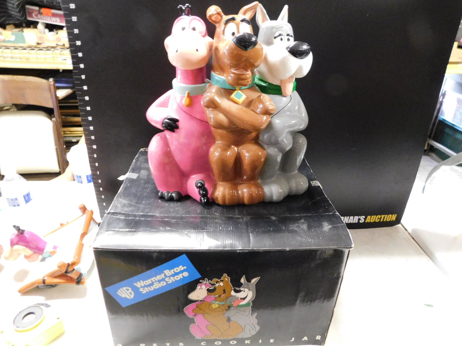 3 Pets Cookie Jar Warner Bros.: 3 Pets Cookie Jar. Warner Bros. Studio Store 1998. Measures approx. 13.5" tall. Has some light craze and a few nicks in the paint. Comes in Box. You are bidding at a live sale, please read the terms a