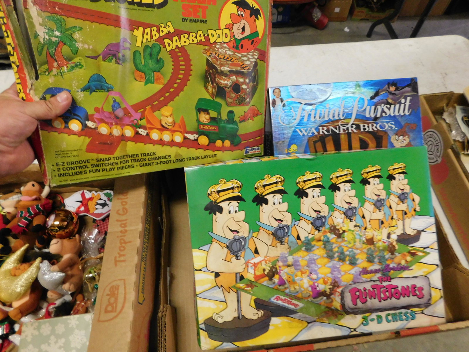 Box Lot of Flintstones and Warner Bros Board Games: Box Lot of Flintstones and Warner Bros Board Games. You are bidding at a live sale. Please read the terms and conditions. This sale will be broadcast live on sale day with full descriptions of each lo