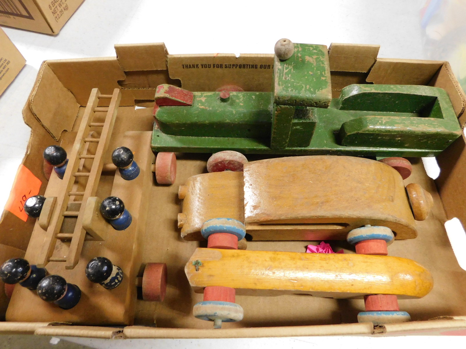 Box Lot of Vintage Wooden Cars: Box Lot of Vintage Wooden Cars. You are bidding at a live sale. Please read the terms and conditions. This sale will be broadcast live on sale day with full descriptions of each lot being sold, as wel