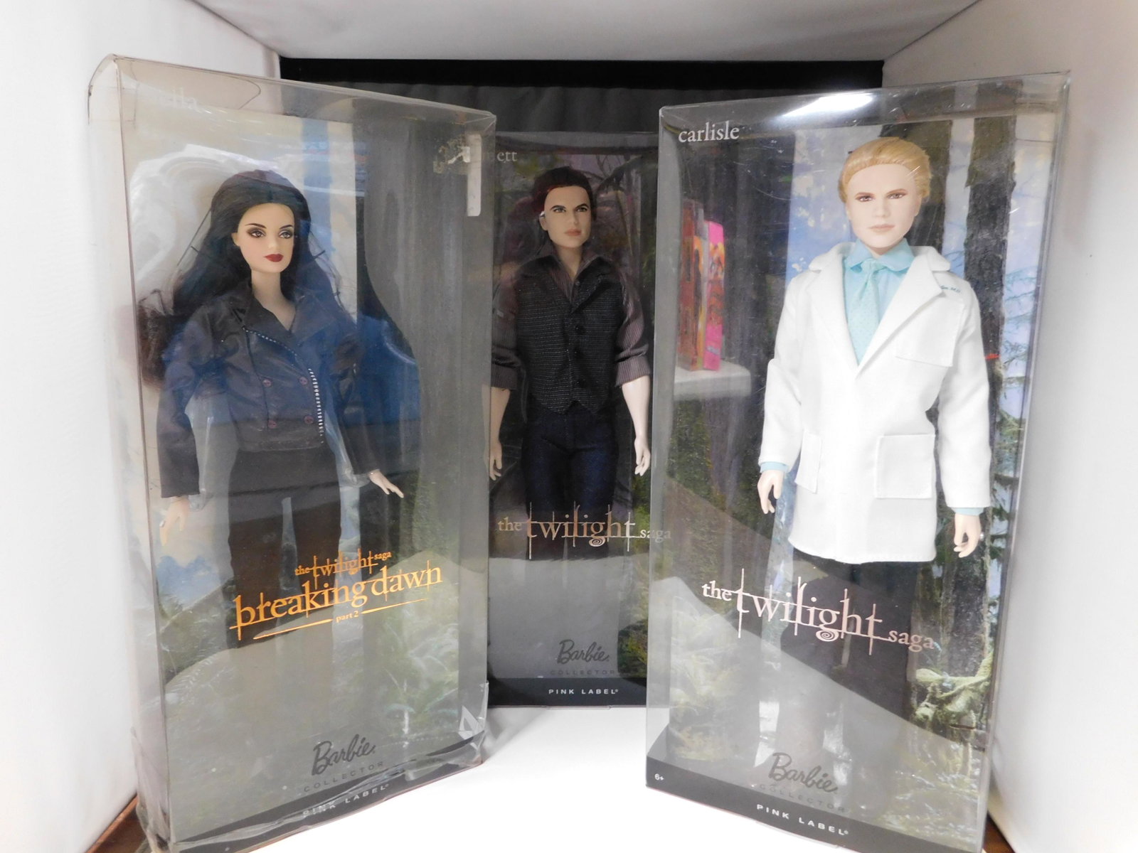 Lot of 3 Barbie Twilight Dolls: Lot of 3 Twilight Barbie Pink Label Dolls. Included in this lot are Carlisle, Emmett and Bella. You are bidding at a live sale. Please read the terms and conditions. This sale will be broadcast live o