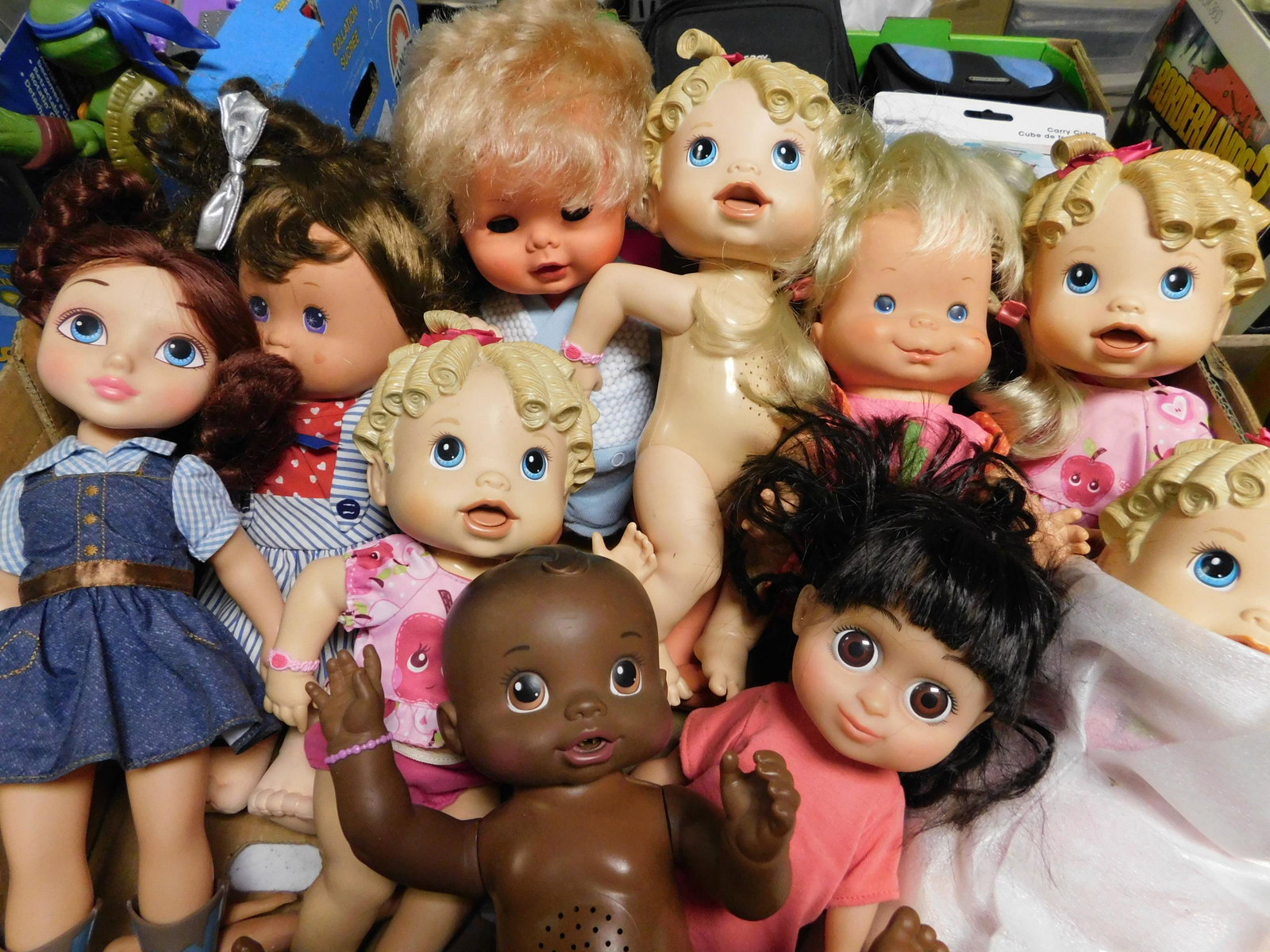 Box Lot of Dolls: Box Lot of Dolls. You are bidding at a live sale. Please read the terms and conditions. This sale will be broadcast live on sale day with full descriptions of each lot being sold, as well as video fee