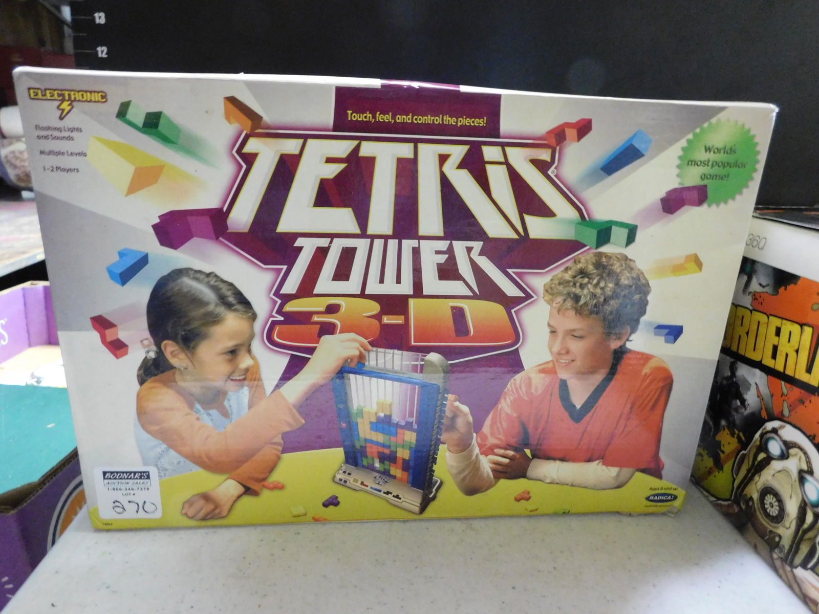 Electronic Tetris Tower 3D in Box: Electronic Tetris Towed 3D in Box. You are bidding at a live sale. Please read the terms and conditions. This sale will be broadcast live on sale day with full descriptions of each lot being sold, as