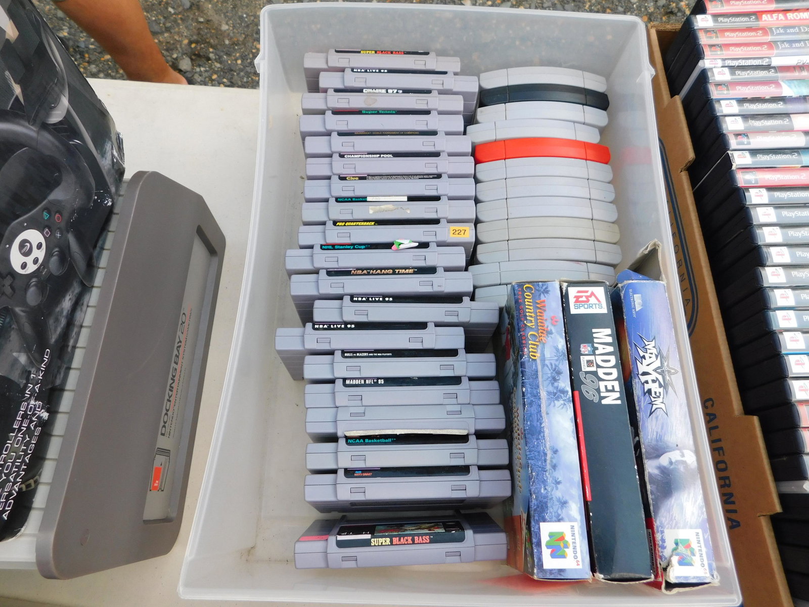 Box Lot of Nintendo 64 and SNES Games: Box Lot of Nintendo 64 and SNES Games. You are bidding at a live sale. Please read the terms and conditions. This sale will be broadcast live on sale day with full descriptions of each lot being sold,