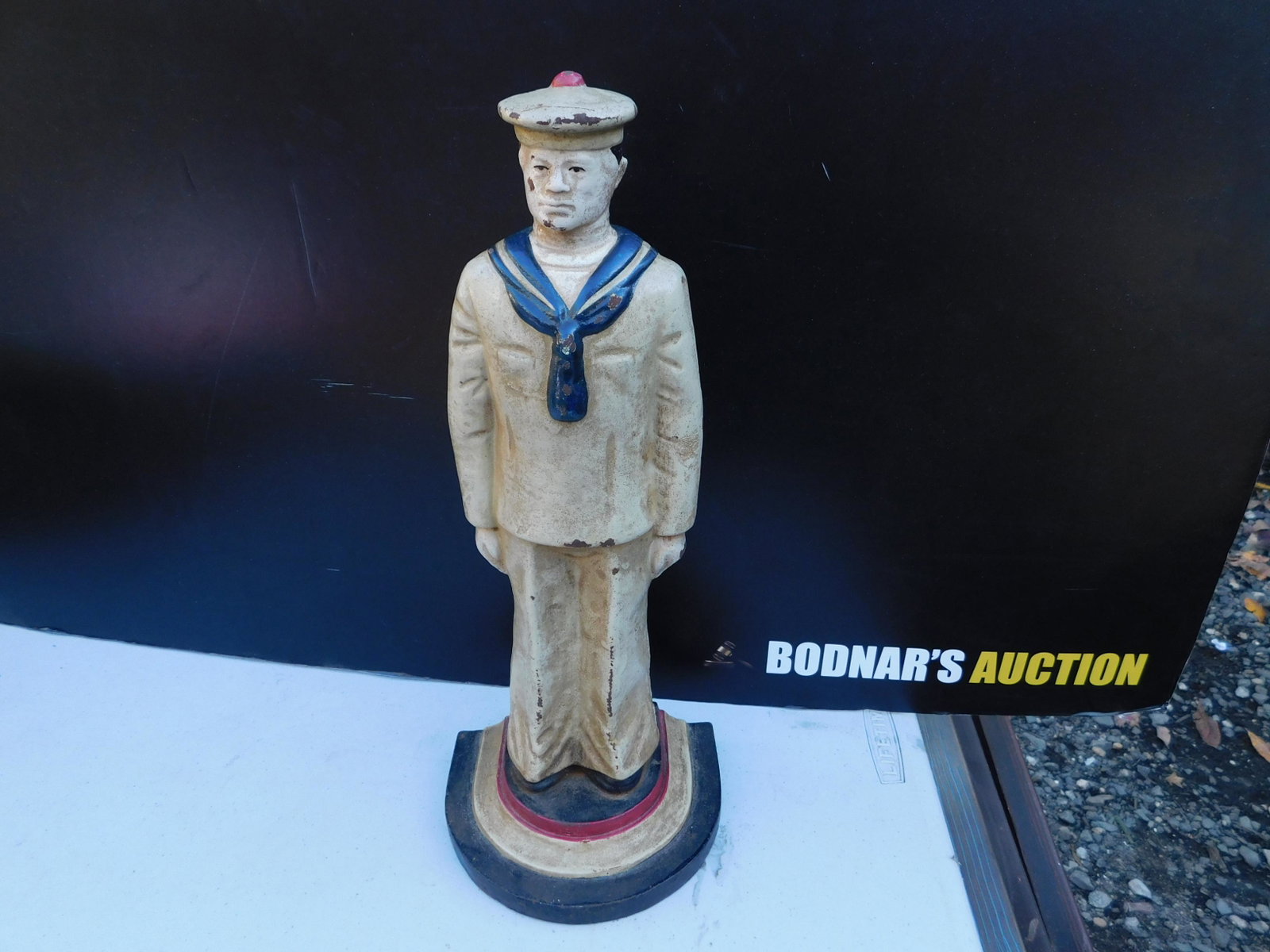 Cast Iron US Sailor Doorstop: Cast Iron US Sailor Vintage Doorstop. Measures 13.5" tall. You are bidding at a live sale. Please read the terms and conditions. This sale will be broadcast live on sale day with full descriptions of 