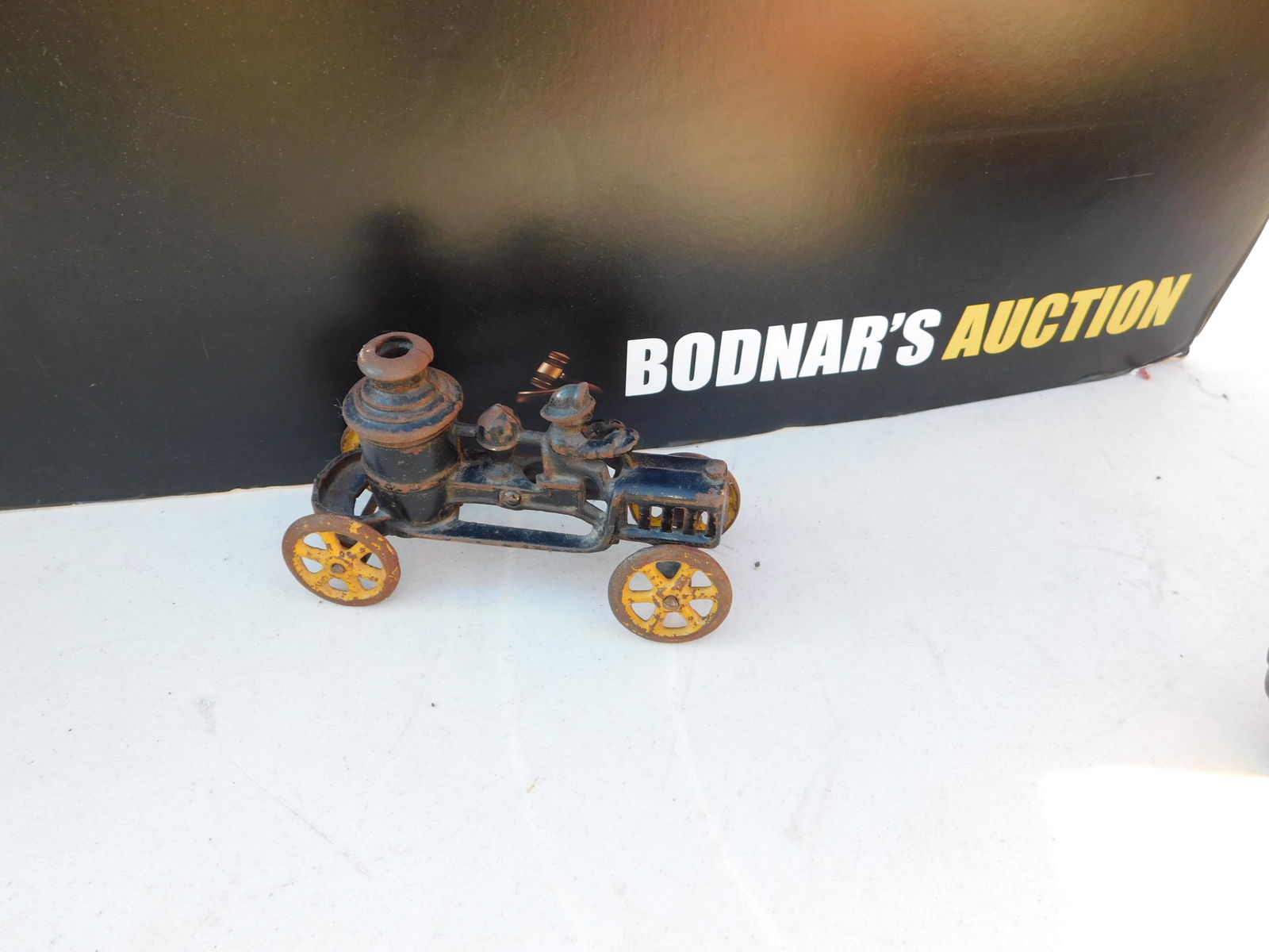 Antique Cast Iron Fire Pumper: Antique Cast Iron Fire Pumper Toy. You are bidding at a live sale. Please read the terms and conditions. This sale will be broadcast live on sale day with full descriptions of each lot being sold, as